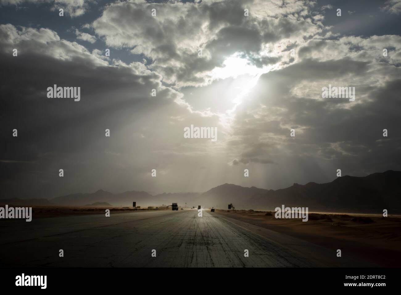 Crossing the Wadi Rum desert in the Highway Aqaba-Petra. Stock Photo