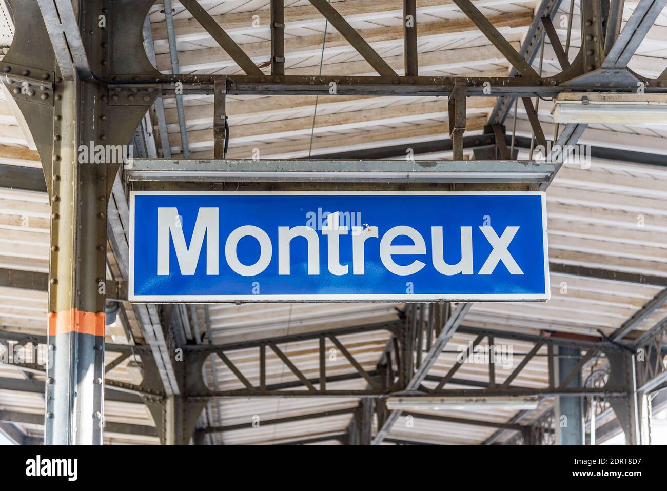 Blue sign indicating the name of a train stop Montreux on Lake Geneve
