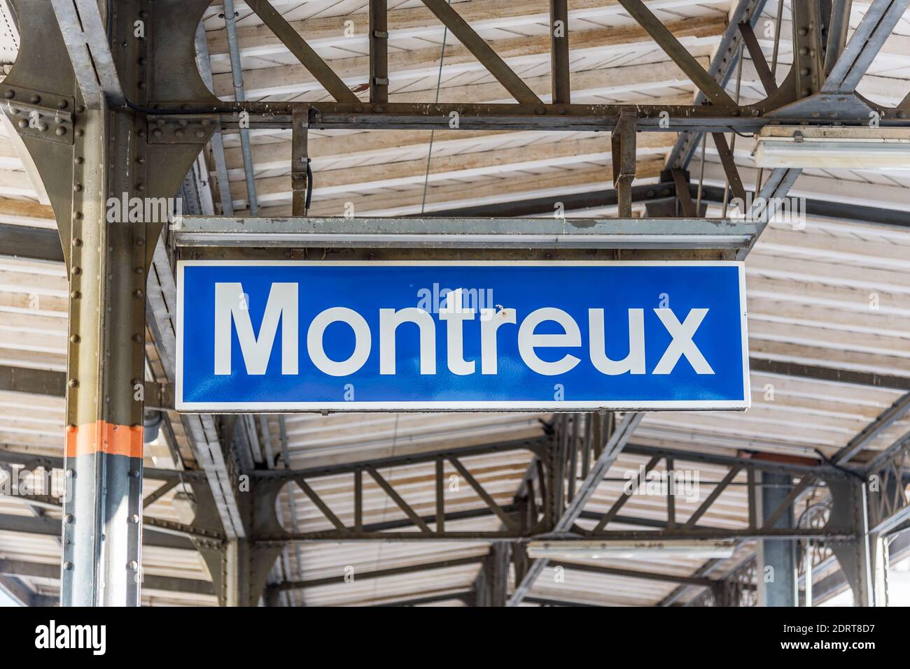 Blue sign indicating the name of a train stop Montreux on Lake Geneve Stock Photo