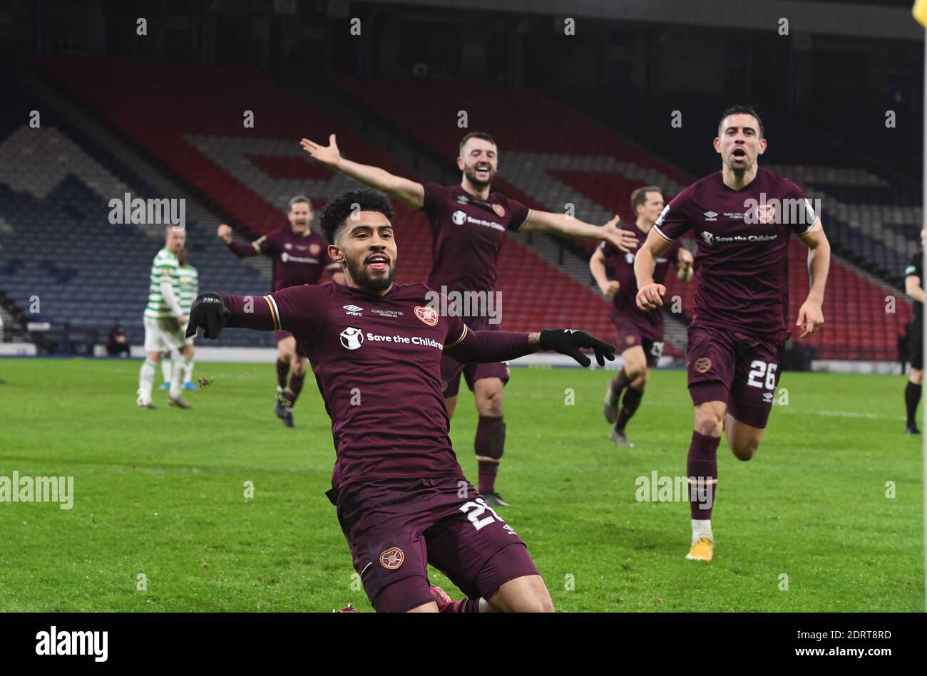 Hampden Park, Glasgow, Scotland, UK.  20th December, 2020. William Hill Scottish Cup Final 2019-20.  Pic shows Hearts Josh Ginnelly (L) celebrating his equalising goal in the 3-3 draw AET 4-3 with Craig Halkett & Olly Lee. Credit: eric mccowat/Alamy Live News Stock Photo
