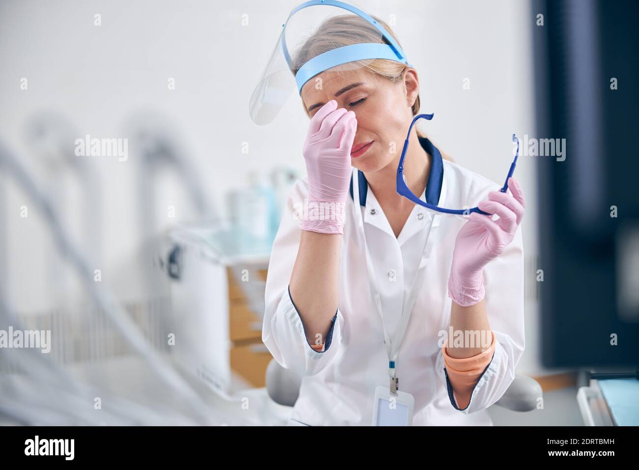 Female Dentist Feeling Tired After Procedures In Office Stock Photo Alamy