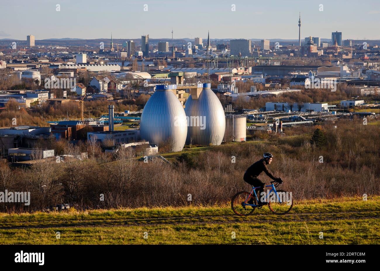 Dortmund, Ruhrgebiet, North Rhine-Westphalia, Germany - city panorama Dortmund, cyclist on the Deusenberg in front of skyline of Dortmund city center, Stock Photo