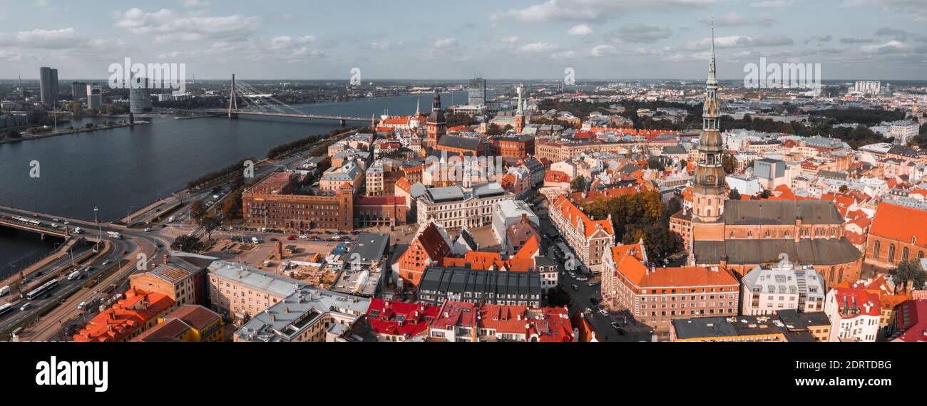 An aerial shot of an epic old town with many buildings and a river with ...