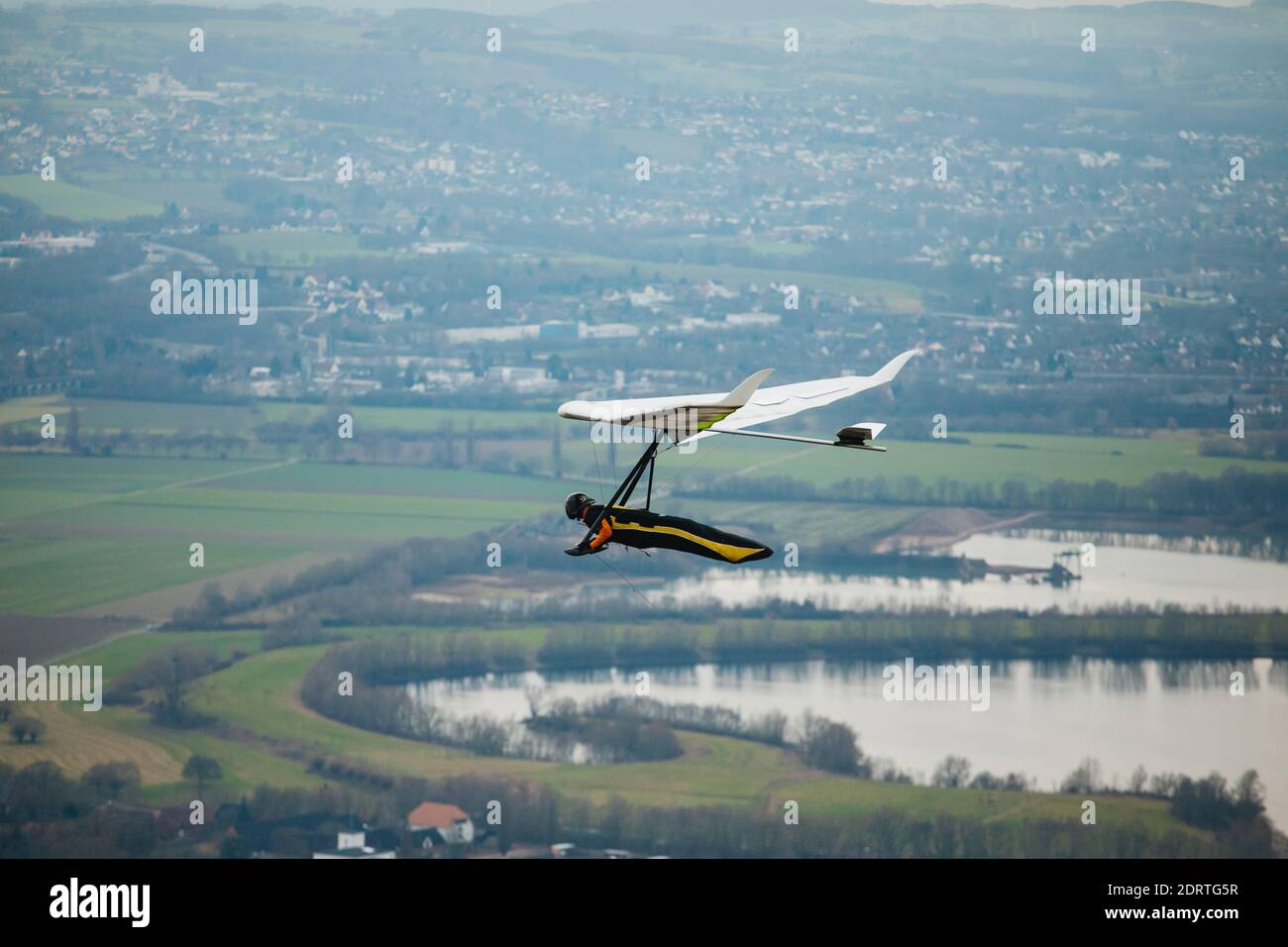 Hang glider in the air on a sunny day. Stock Photo