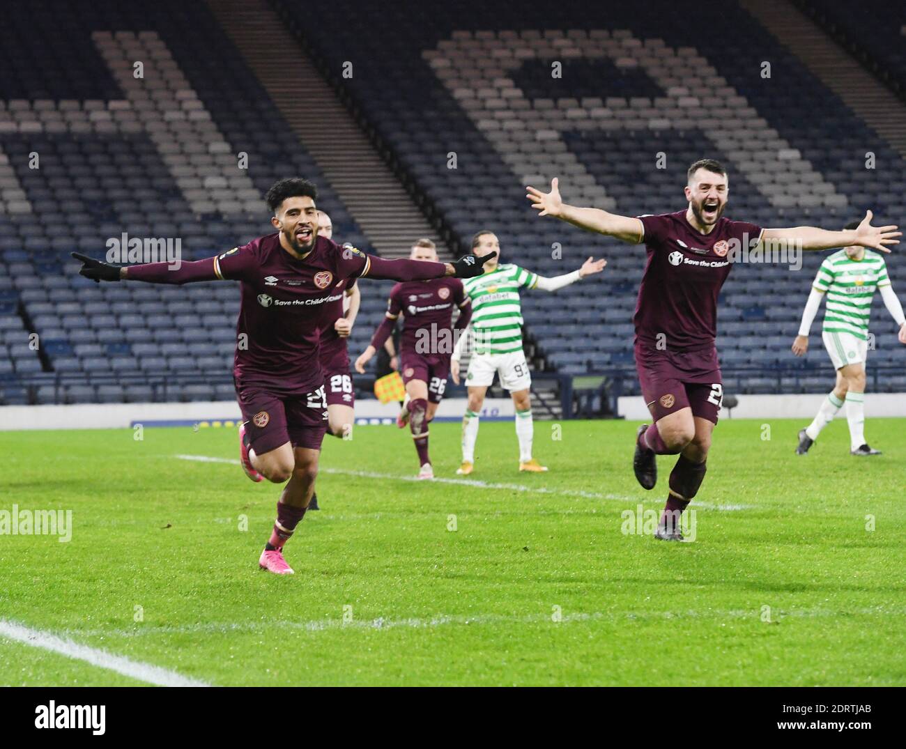 Hampden Park, Glasgow, Scotland, UK.  20th December, 2020. William Hill Scottish Cup Final 2019-20.  Pic shows Hearts Josh Ginnelly (L) celebrating his equalising goal in the 3-3 draw AET 4-3 with Craig Halkett Credit: eric mccowat/Alamy Live News Stock Photo