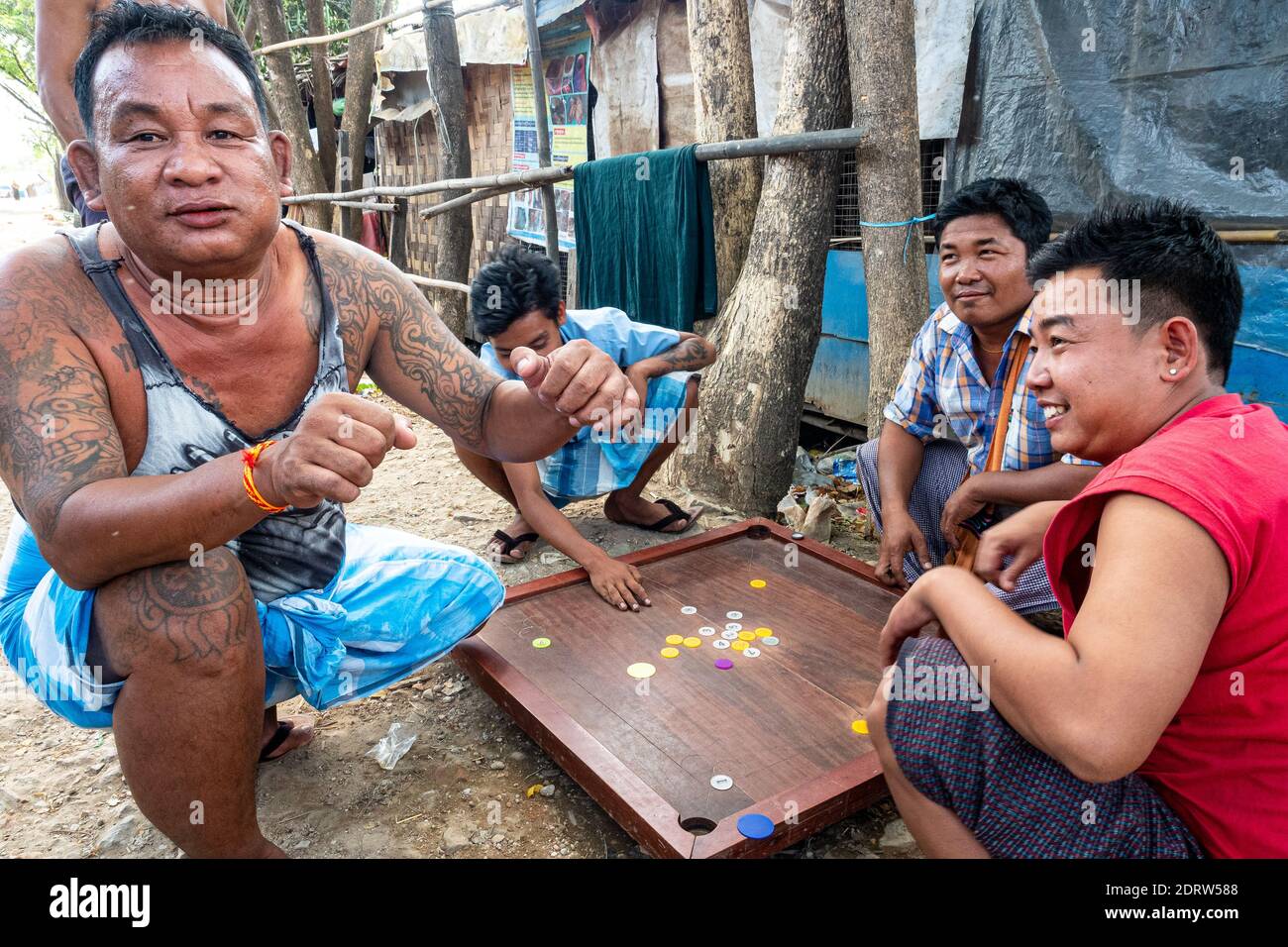 A man with numerous tattoos in the Burmese countryside. Dagon Seikkan Township.Yangon Myanmar 2019 Stock Photo