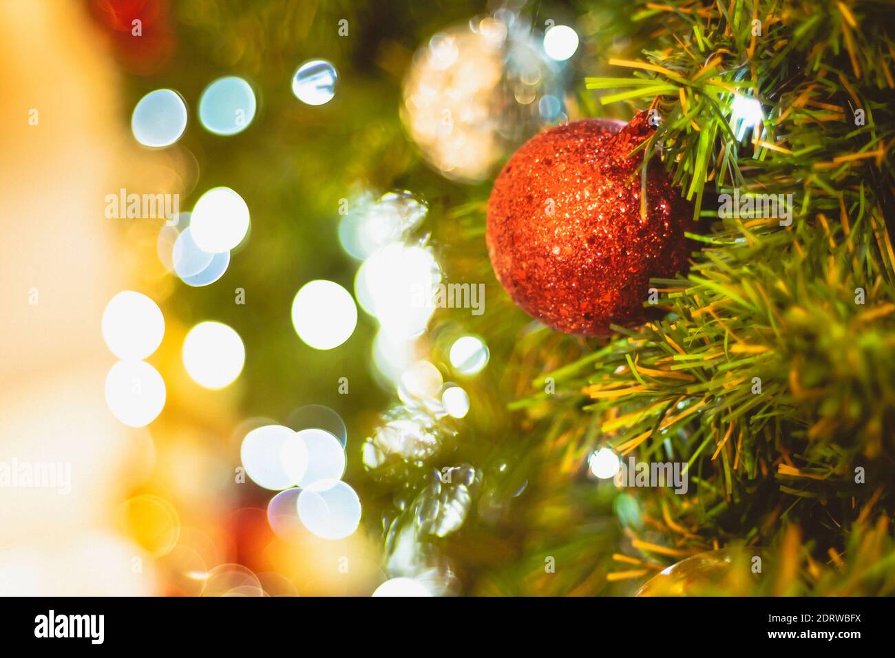 Christmas Tree red Ball And gold Bokeh Background Stock Photo - Alamy