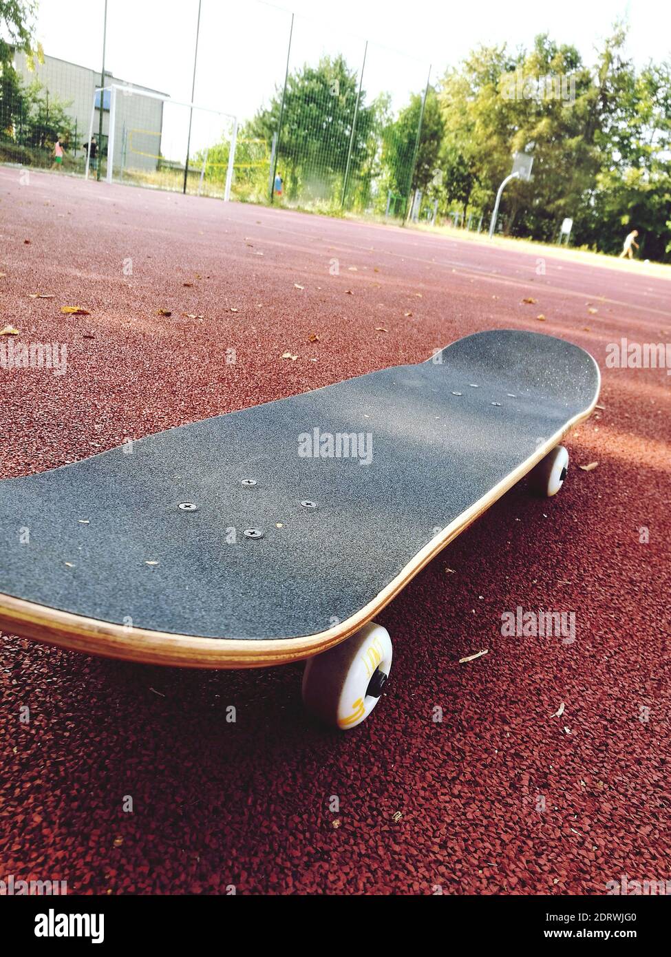 Close-up Of Skateboard On Footpath Stock Photo - Alamy