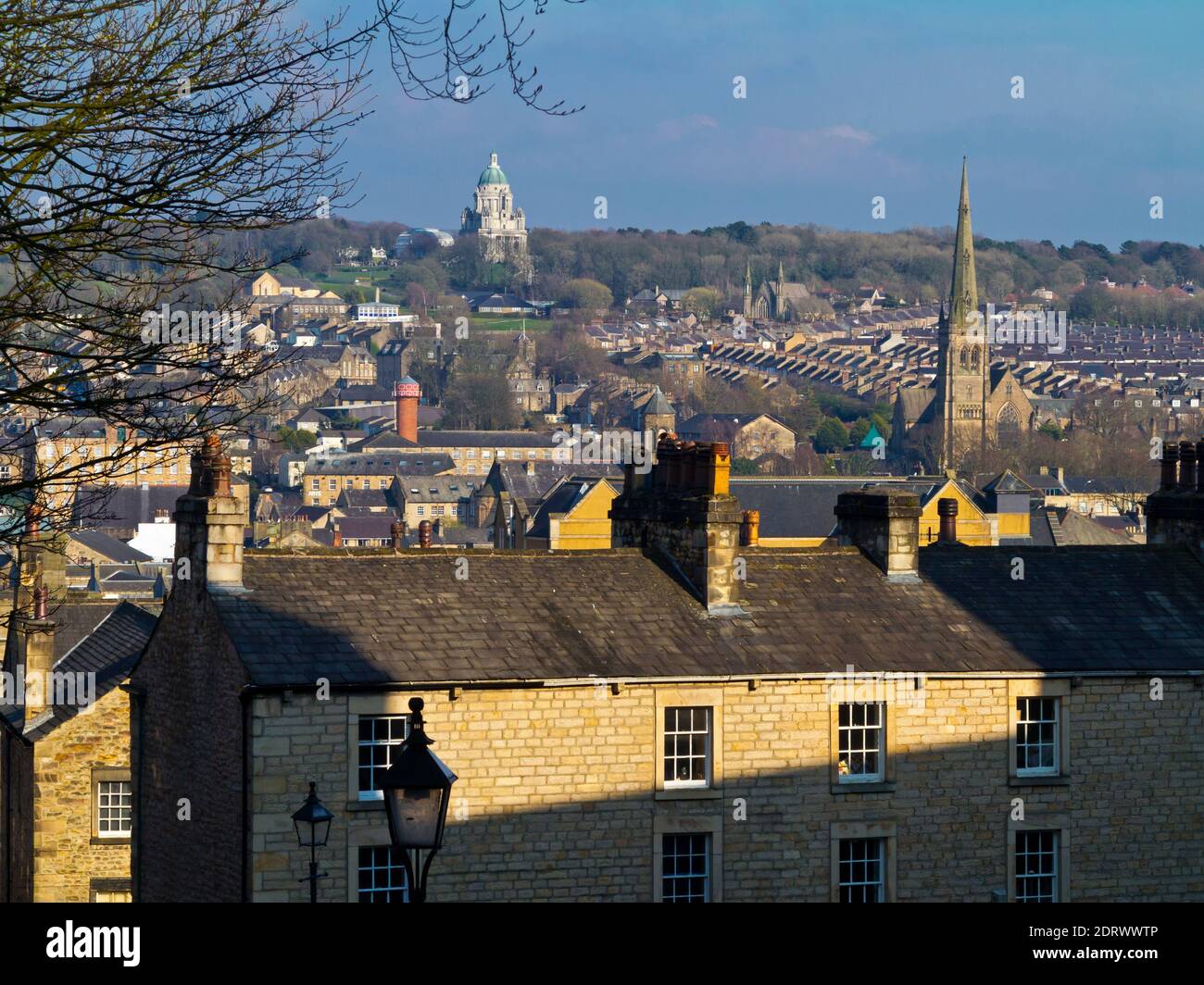 View across rooftops in the City of Lancaster Lancashire England UK towards the Ashton Memorial in Williamson Park. Stock Photo