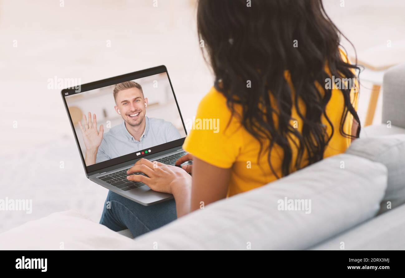 Collage with young black woman talking online to her beloved man, making video call, having conference on web Stock Photo