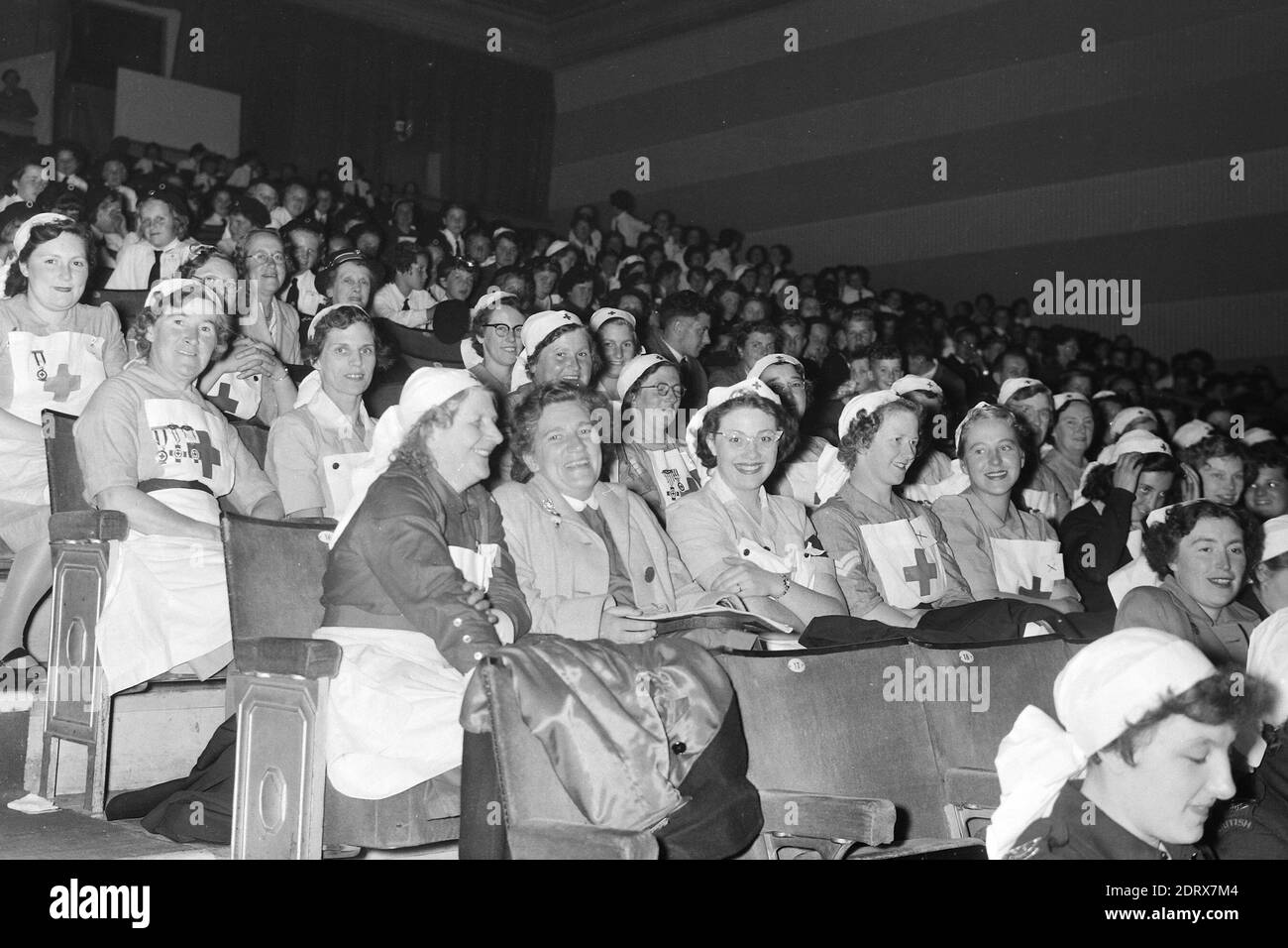 Butlins Holiday Camp. Skegness, Lincolnshire, England, UK. Scanned negatives fro the 1950s Women from the Red Cross in theatre seated area Stock Photo