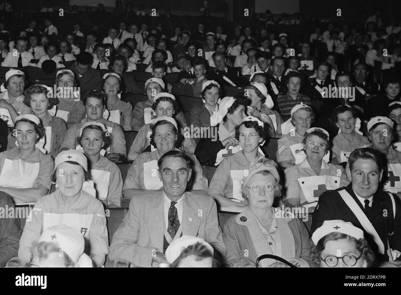 Butlins Holiday Camp. Skegness, Lincolnshire, England, UK. Scanned negatives fro the 1950s Women from the Red Cross in theatre seated area Stock Photo