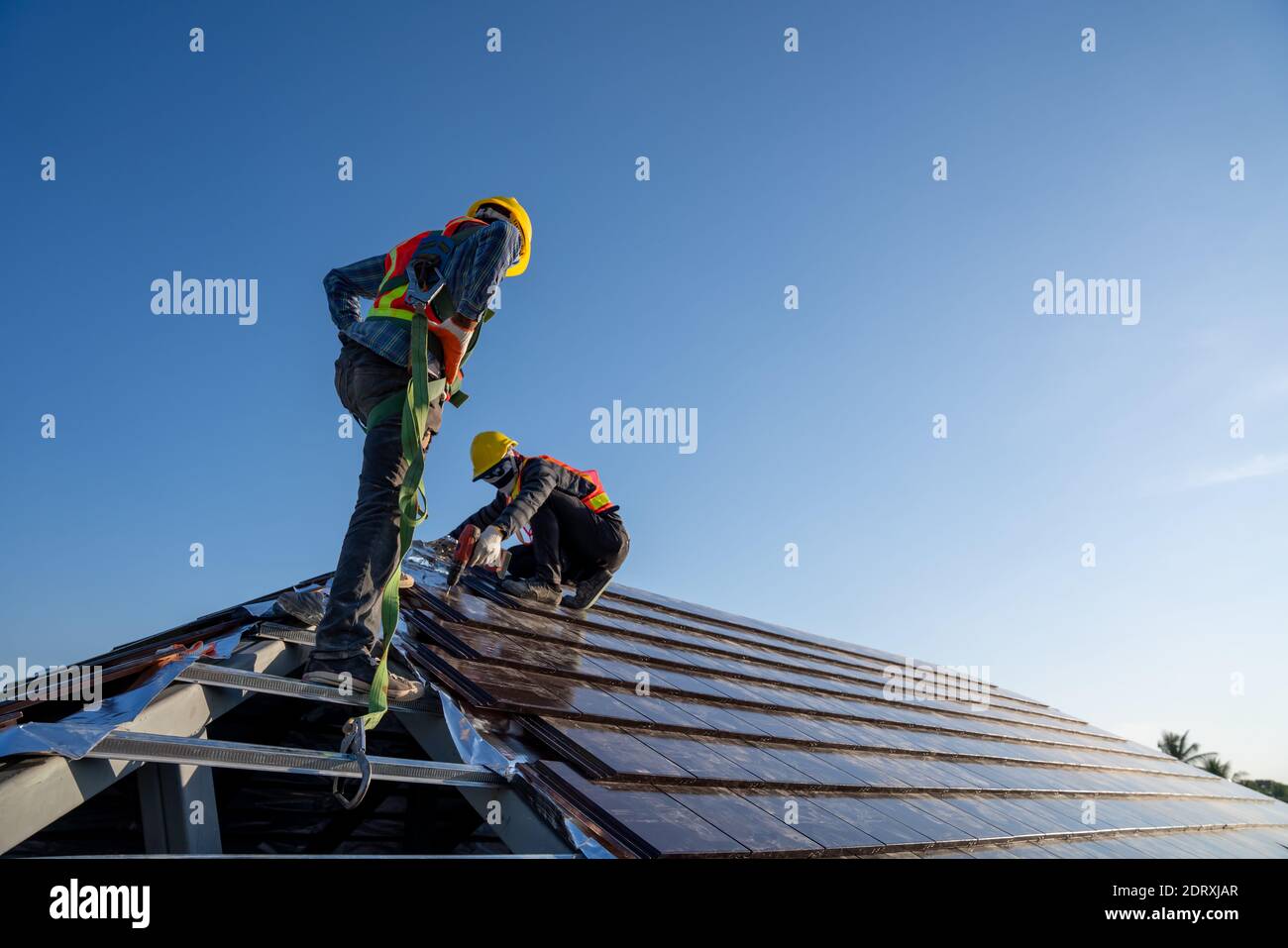 Construction worker wearing safety height equipment harness belt during
