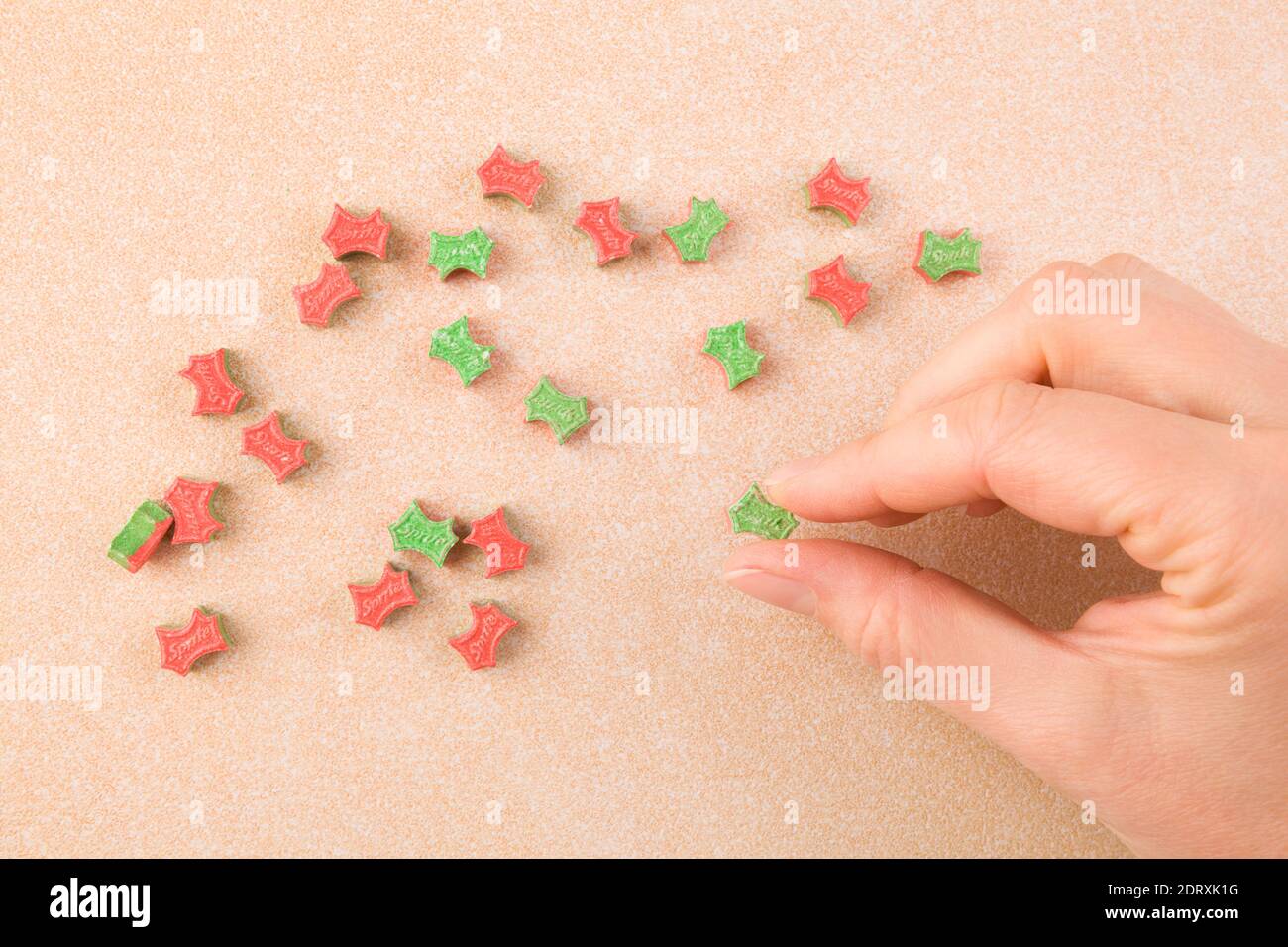 Ecstasy pill in female hand. MDMA assisted psychedelic therapy. Stock Photo