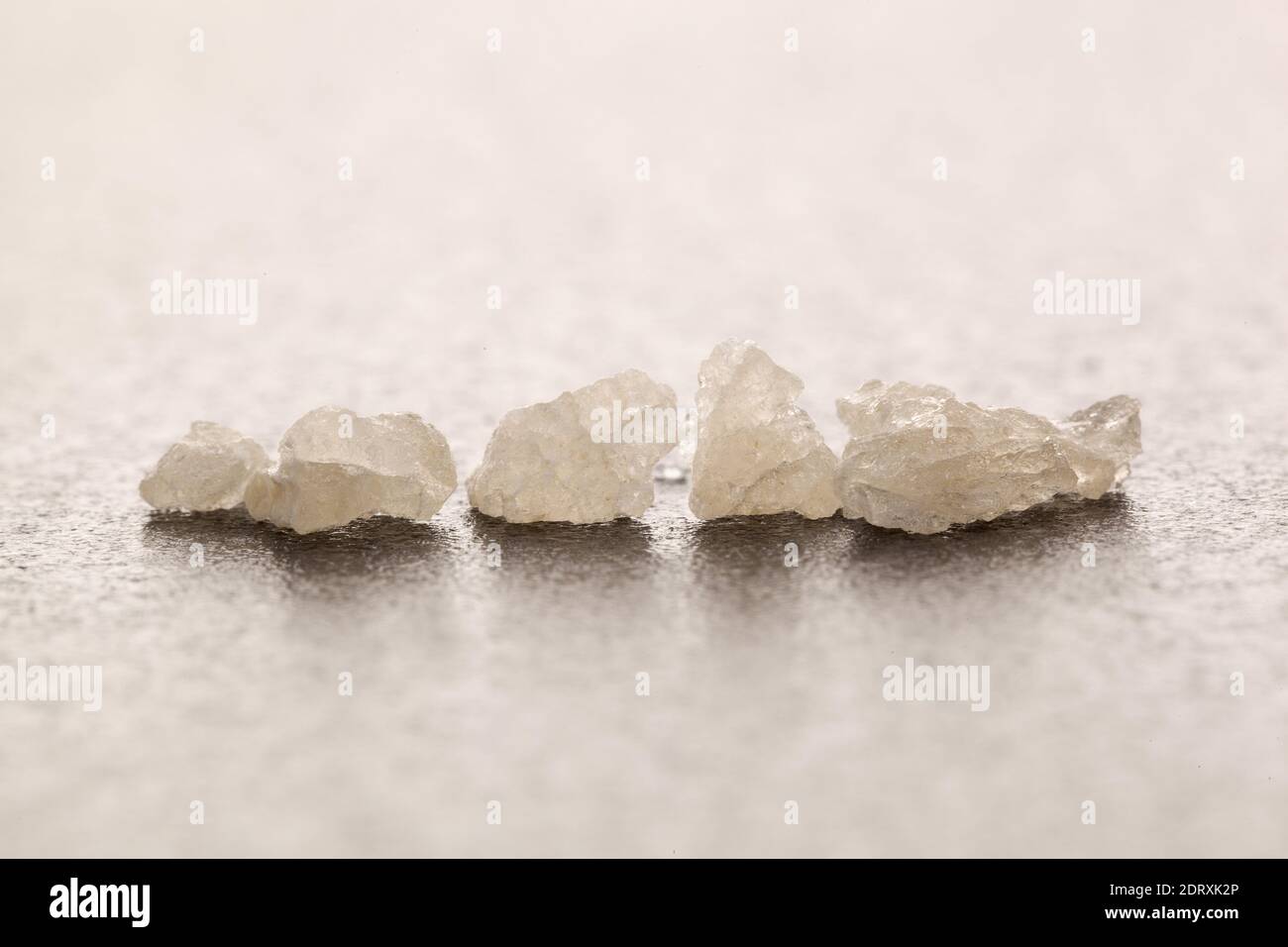 Ecstasy crystals close-up. MDMA-Assisted Psychotherapy. Stock Photo