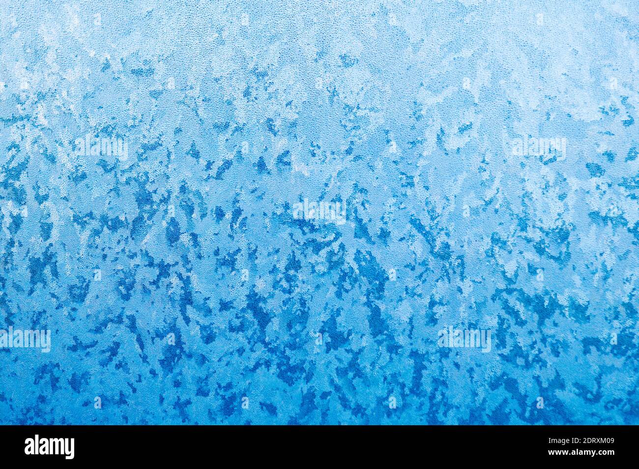 Close-up of frost crystals form patterns on a window pane Stock Photo