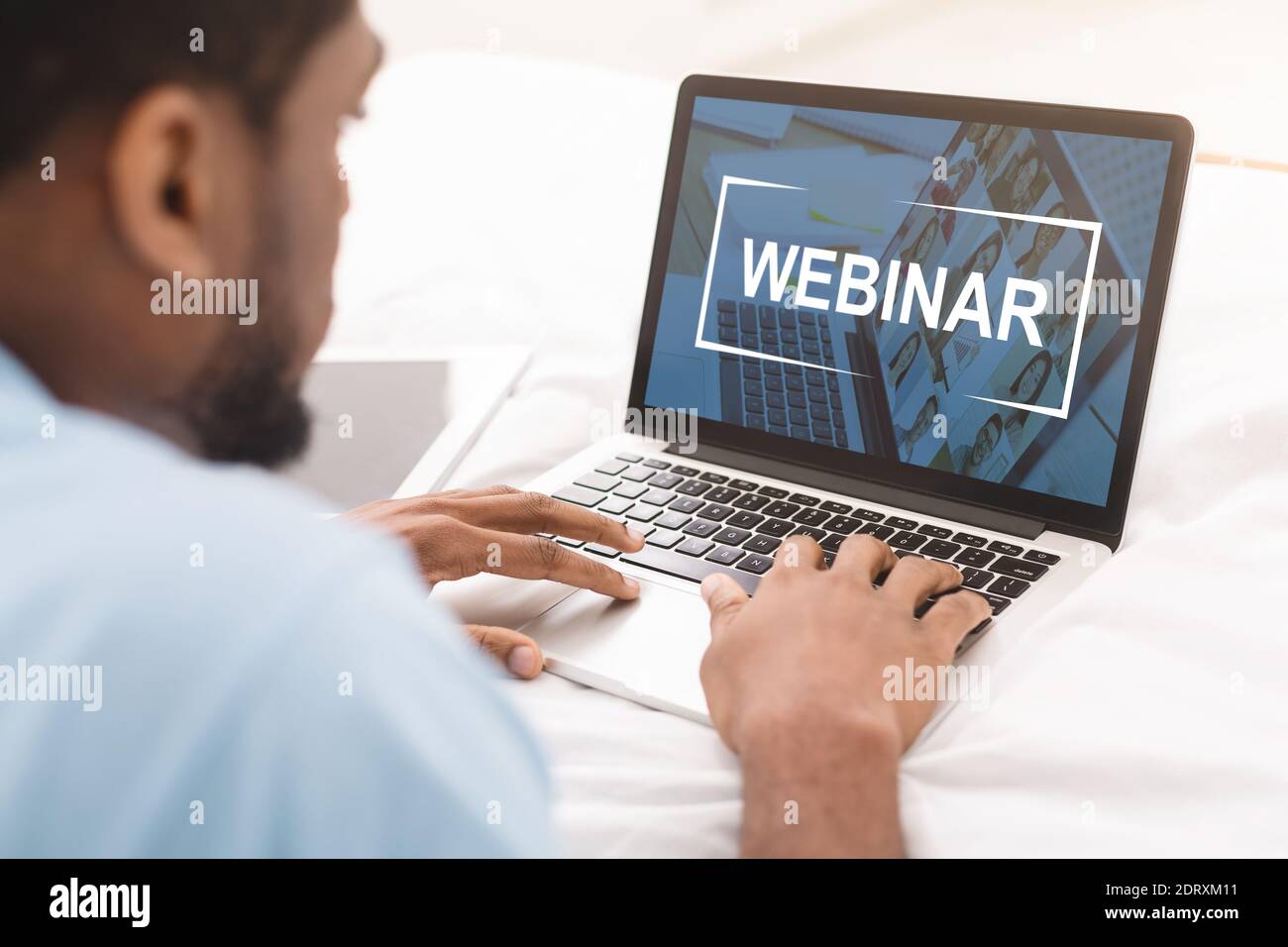 Black man having webinar on laptop while working in office Stock Photo