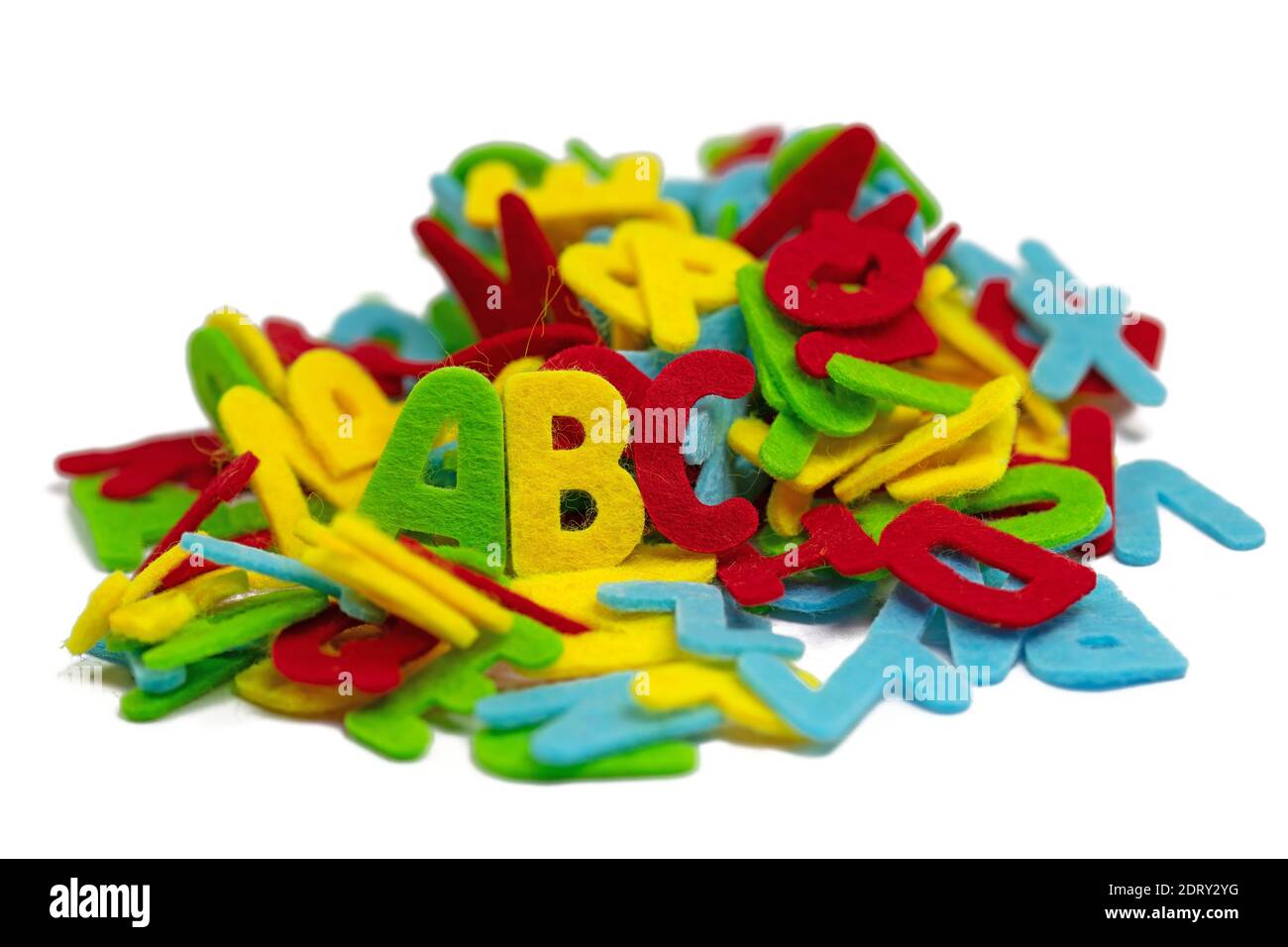 Lots of colorful felt letters against a white background Stock Photo