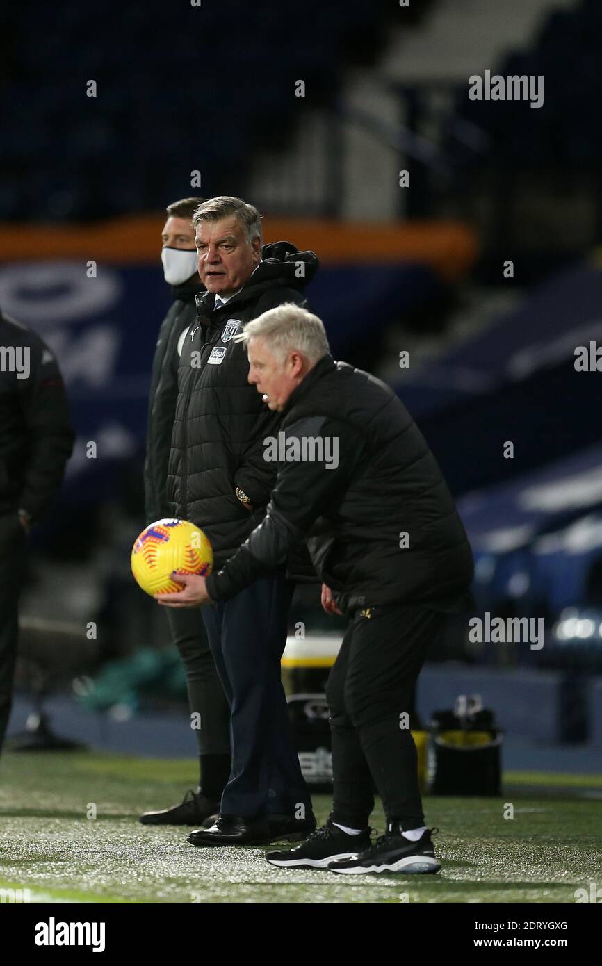 Sammy Lee, the assistant coach of West Bromwich Albion plays with the ball as Sam Allardyce, the manager of West Bromwich Albion looks on. Premier League, West Bromwich Albion v Aston Villa at the Hawthorns in West Bromwich, Midlands on Sunday 20th December 2020. this image may only be used for Editorial purposes. Editorial use only, license required for commercial use. No use in betting, games or a single club/league/player publications. pic by Andrew Orchard/Andrew Orchard sports photography/Alamy Live news Stock Photo