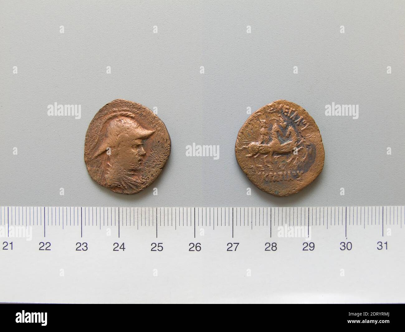 Ruler: Eukratides I, King of Bactria c. 171-145 B.C.Mint: Bactria, Coin of Eukratides I, King of Bactria from Bactria, ca. 80–55 B.C., Copper, 5.80 g, 12:00, 25.3 mm, Made in Bactria, Greek, 2nd century B.C., Numismatics Stock Photo