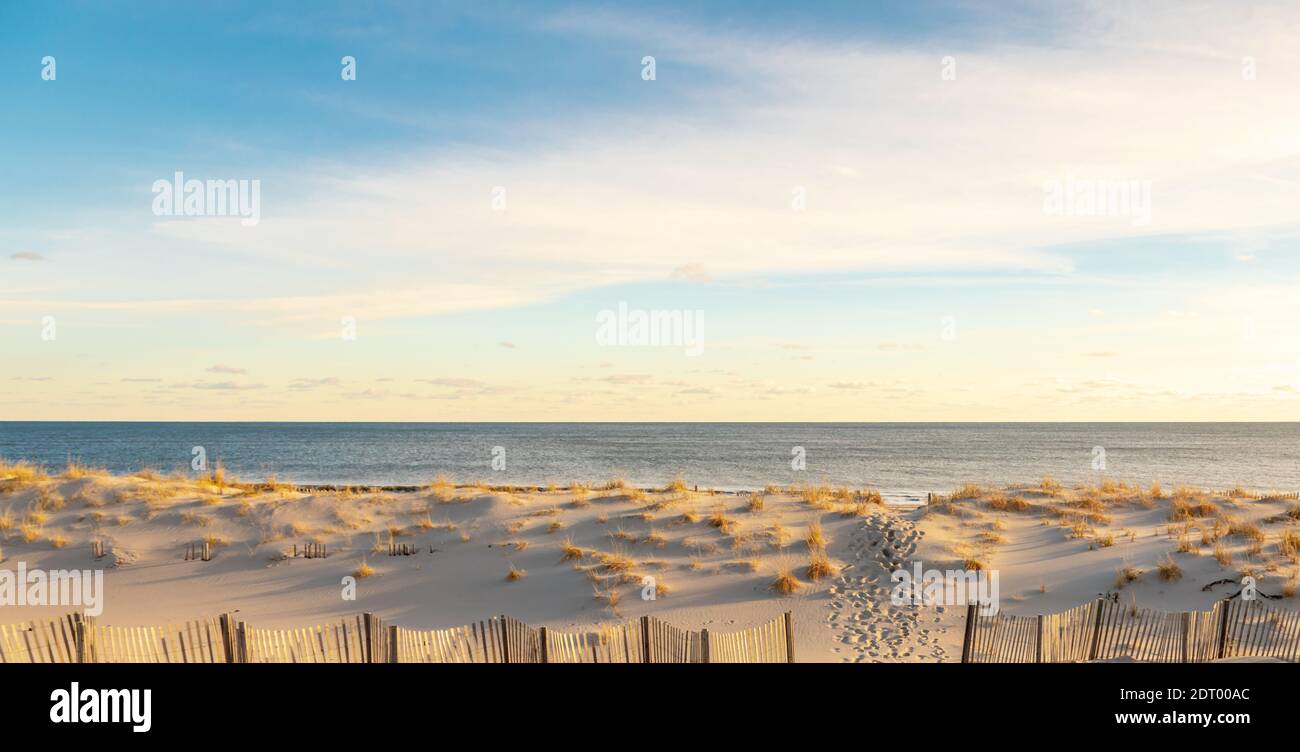 foot prints leading through the dunes at Coopers Beach, Southampton, NY Stock Photo