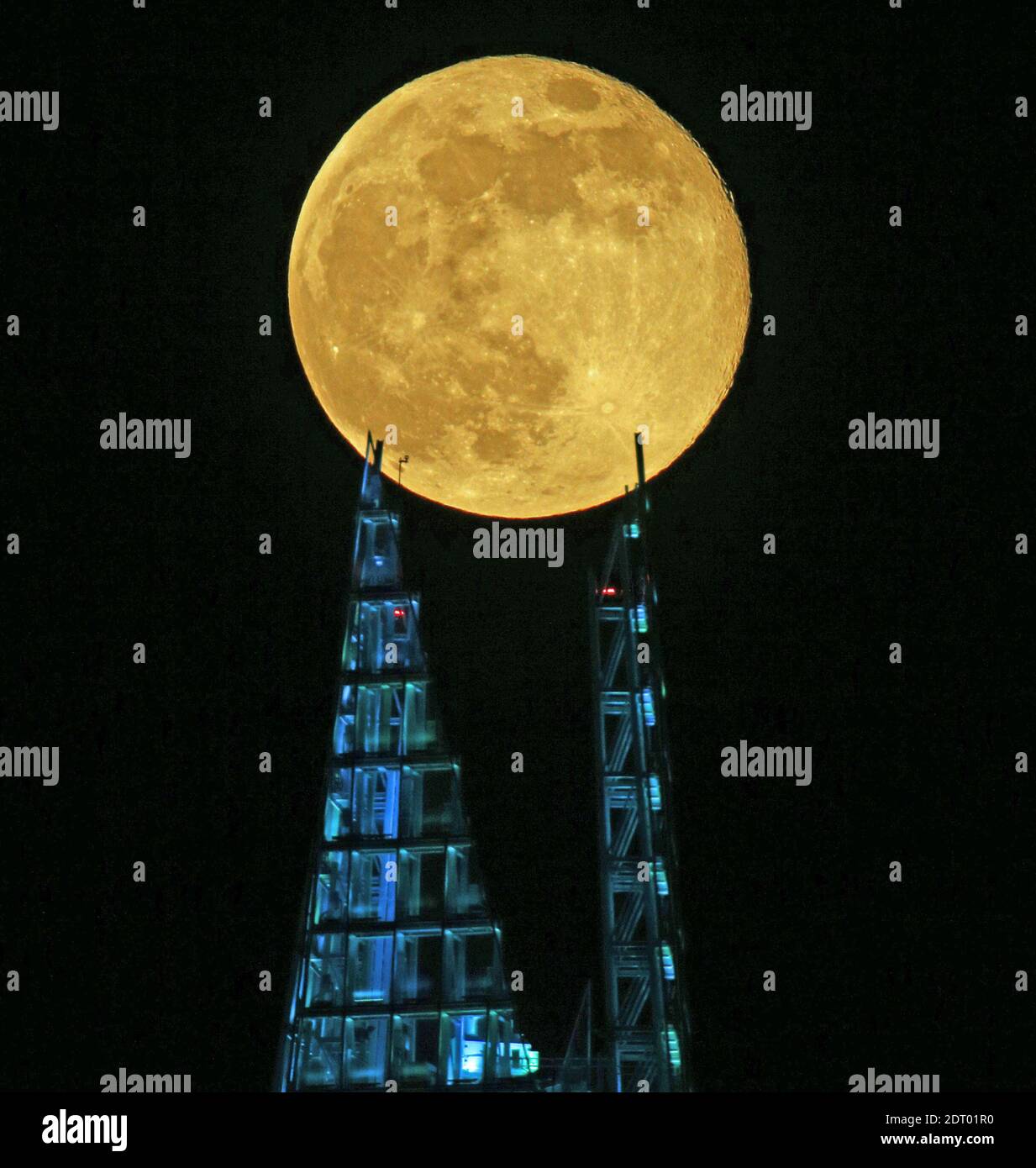 PA REVIEW OF THE YEAR 2020 File photo dated 08/04/20 of a pink supermoon  seen over the Shard building in London. Despite its name, there is no  actual colour change to the