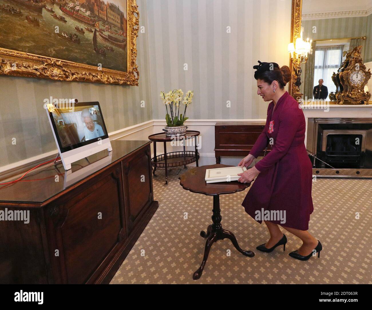 PA REVIEW OF THE YEAR 2020. File photo dated 4/12/2020 of Queen Elizabeth II appearing on a screen by videolink from Windsor Castle, where she is in residence, during a virtual audience to receive Her Excellency Sophie Katsarava, the Ambassador of Georgia, who was at London's Buckingham Palace. Stock Photo