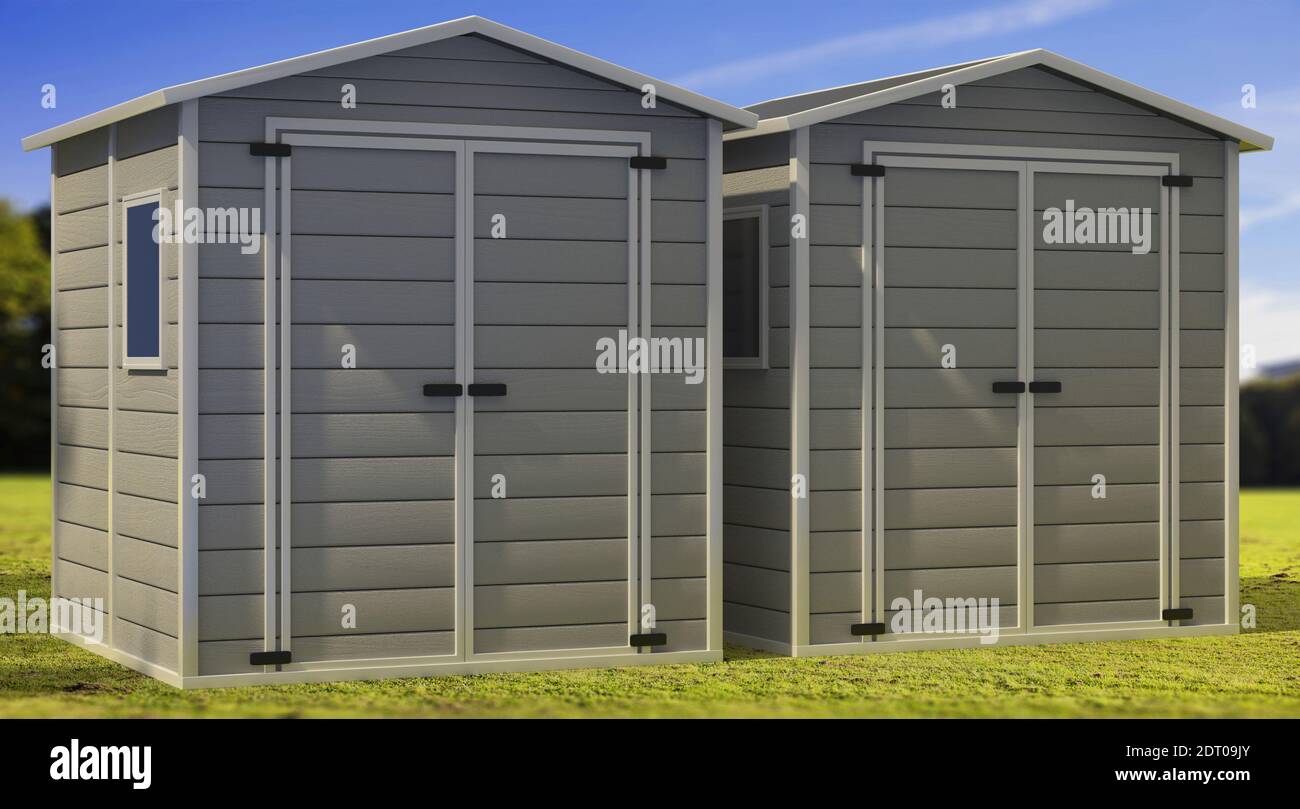 Storage sheds on green lawn and blue sky background. Prefab boxes for tools and equipment storage. 3d illustration Stock Photo
