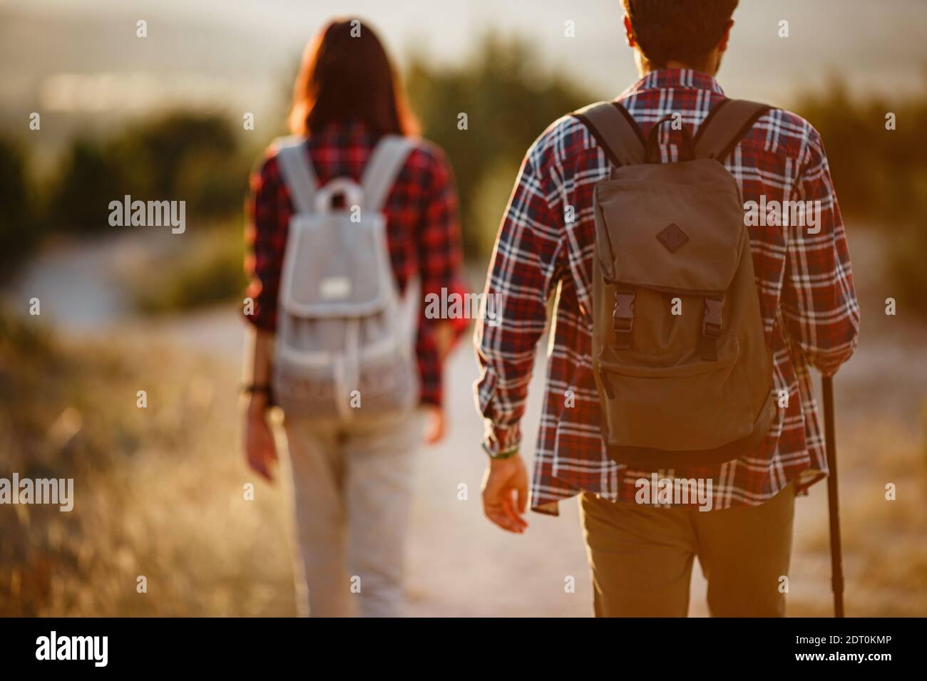 Portrait of happy young couple having fun on their hiking trip ...
