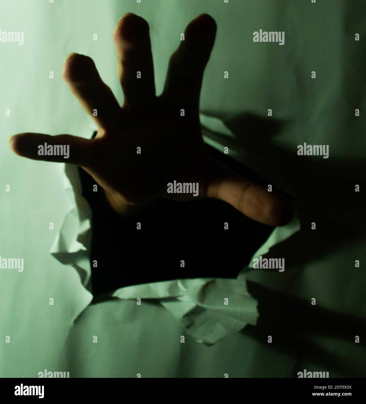 A hand ripping off a paper to get free - break free and depression ...