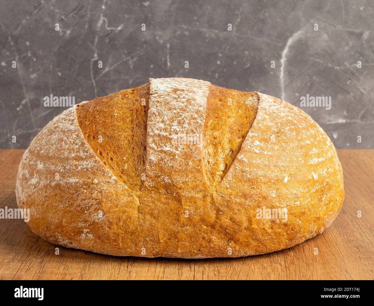 Freshly baked bread at home. Fresh and crispy bread as background with place for text Stock Photo