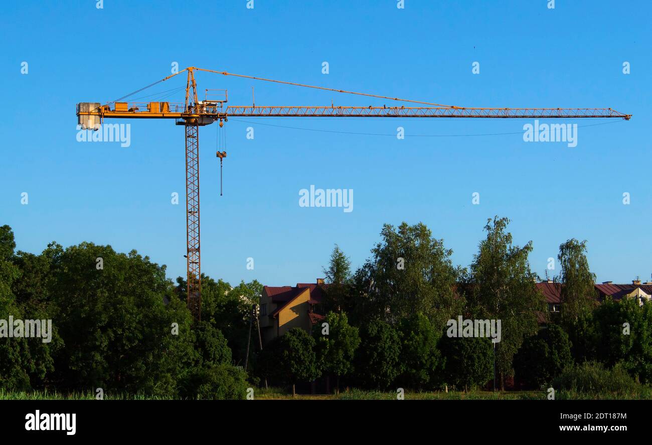 Illegal construction of a high-rise building in a city park near a river Stock Photo