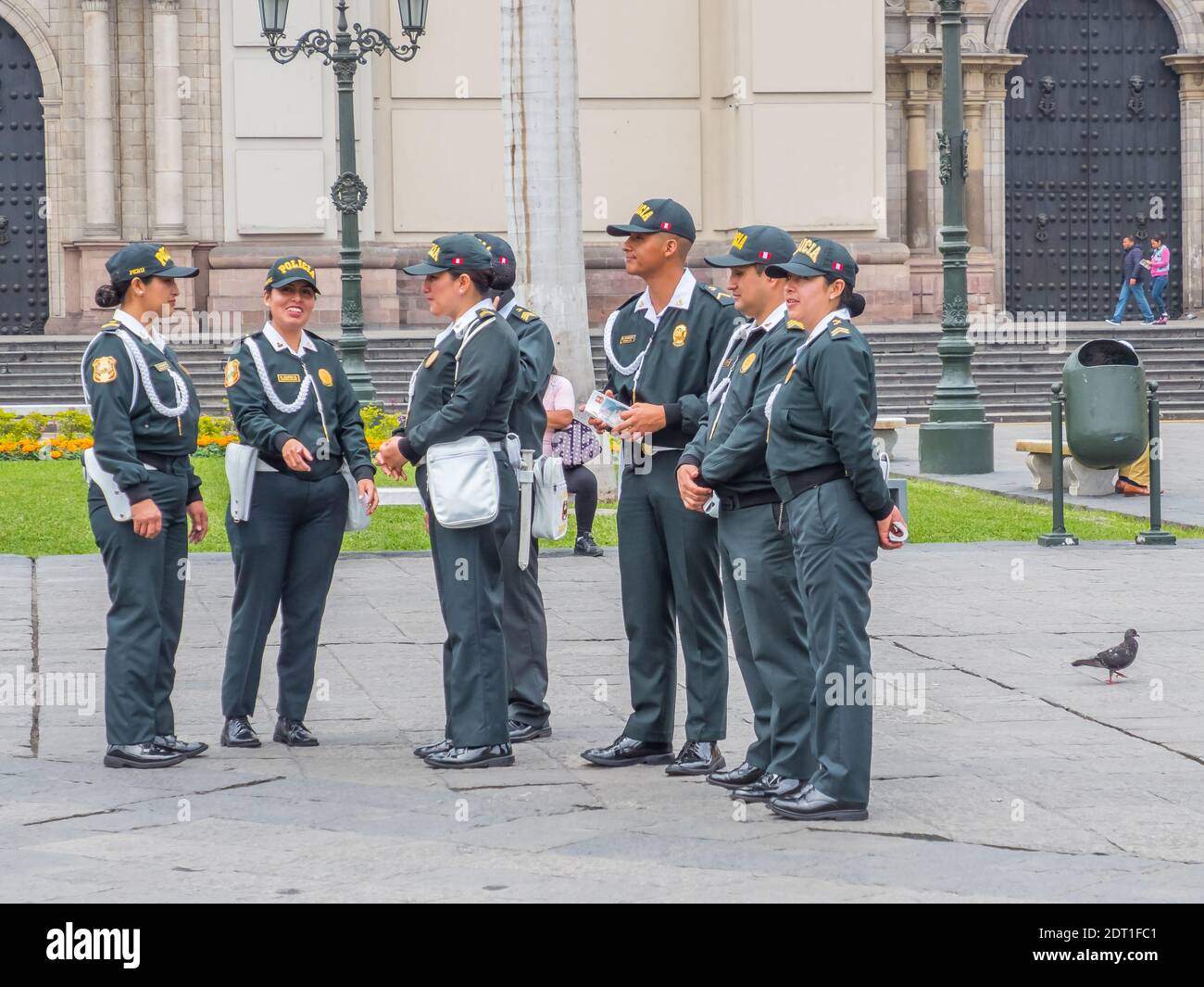 Lima, Peru - September 26, 2019: Group of cheerful policemen in festive costumes on the streets of Lima. Men and women team. Policia. South America. Stock Photo