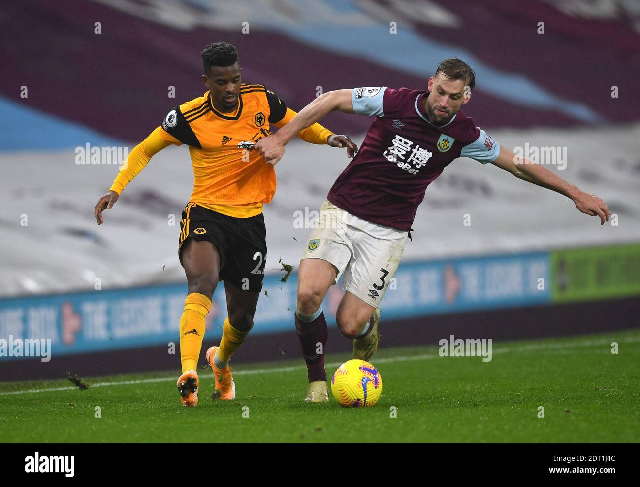 Wolverhampton Wanderers' Nelson Semedo and Burnley's Charlie Taylor battle for the ball during the Premier League match at Turf Moor, Burnley. Stock Photo