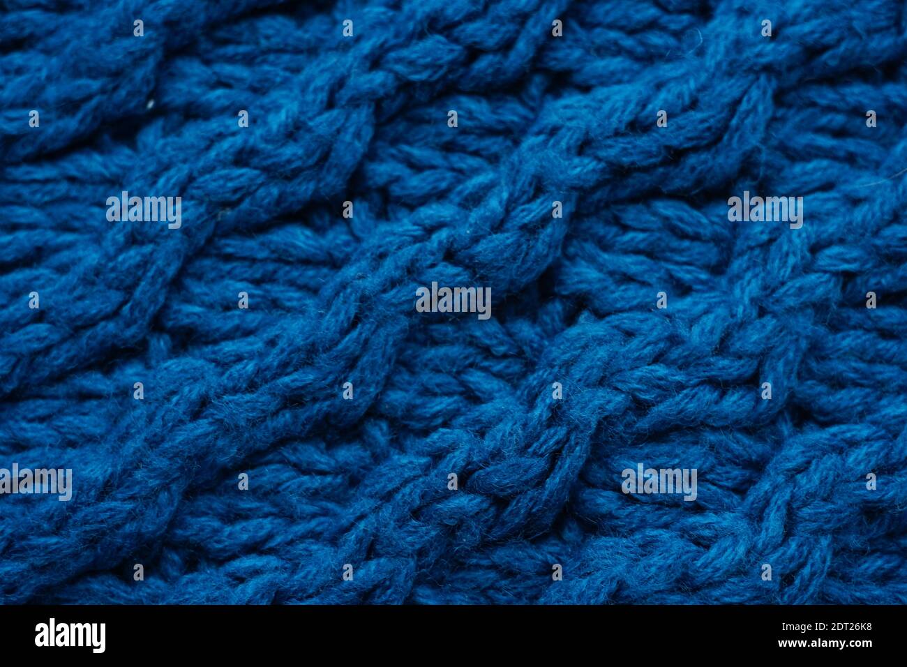 Deep blue background of large knitted thread pattern Stock Photo - Alamy