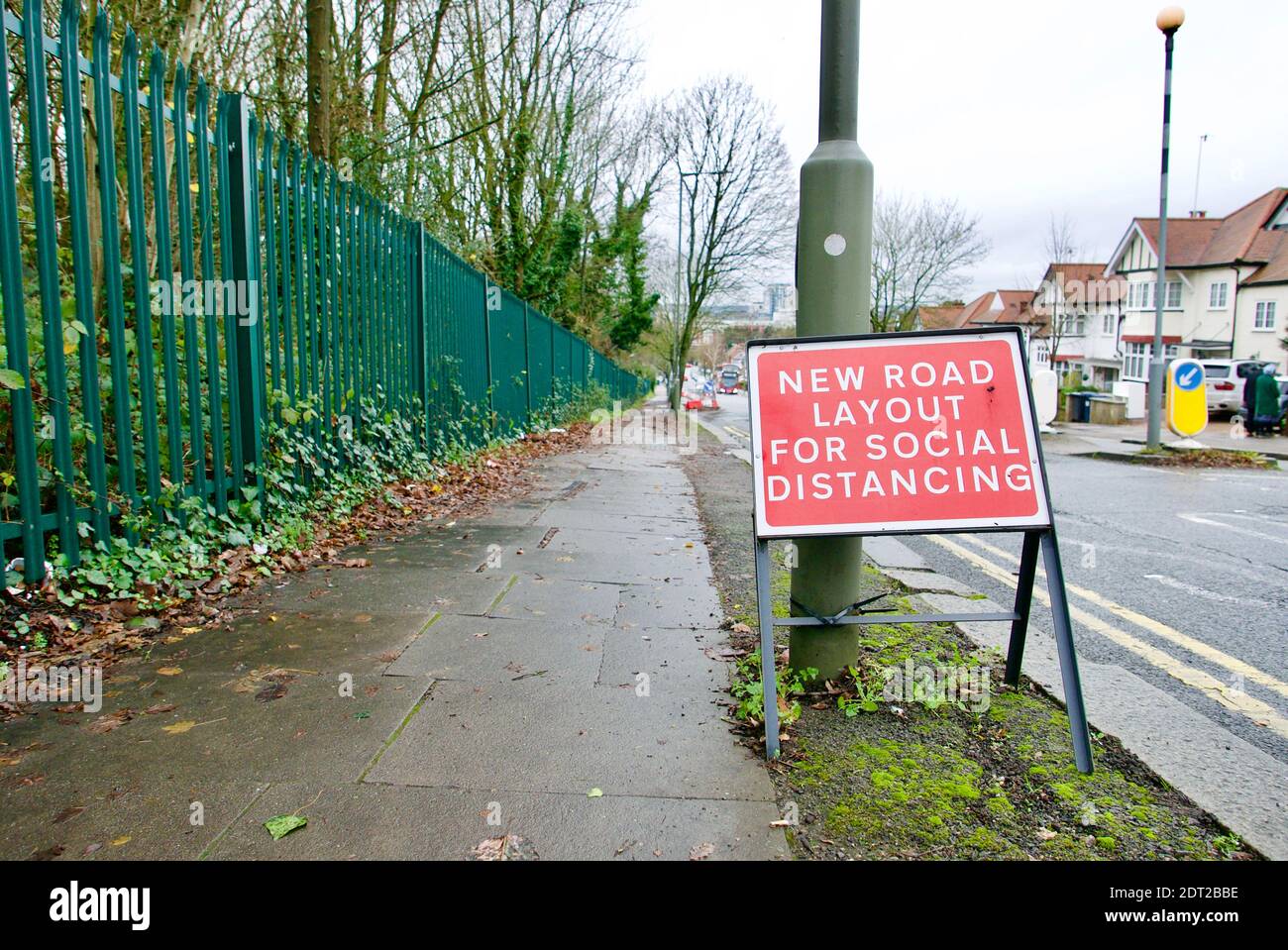 Social distancing pavement extension into the road to allow parents to drop off and collect children from school in covid safe manner. Stock Photo