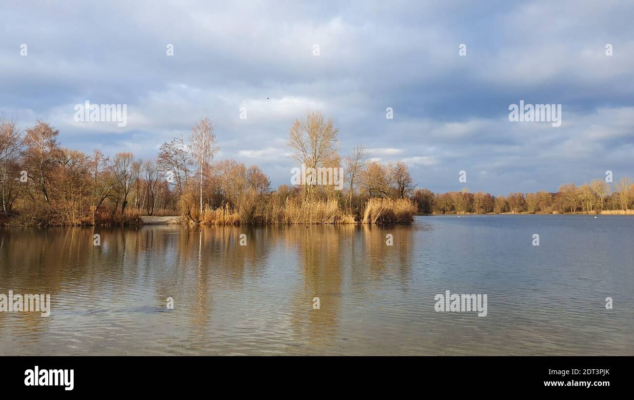 Scenic View Of Lake By Trees Against Sky Stock Photo