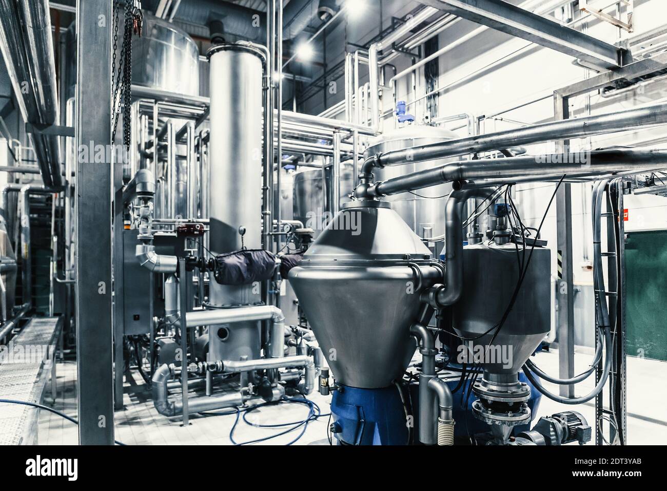 Modern brewery interior. Filtration vats, pipeline, valves and other