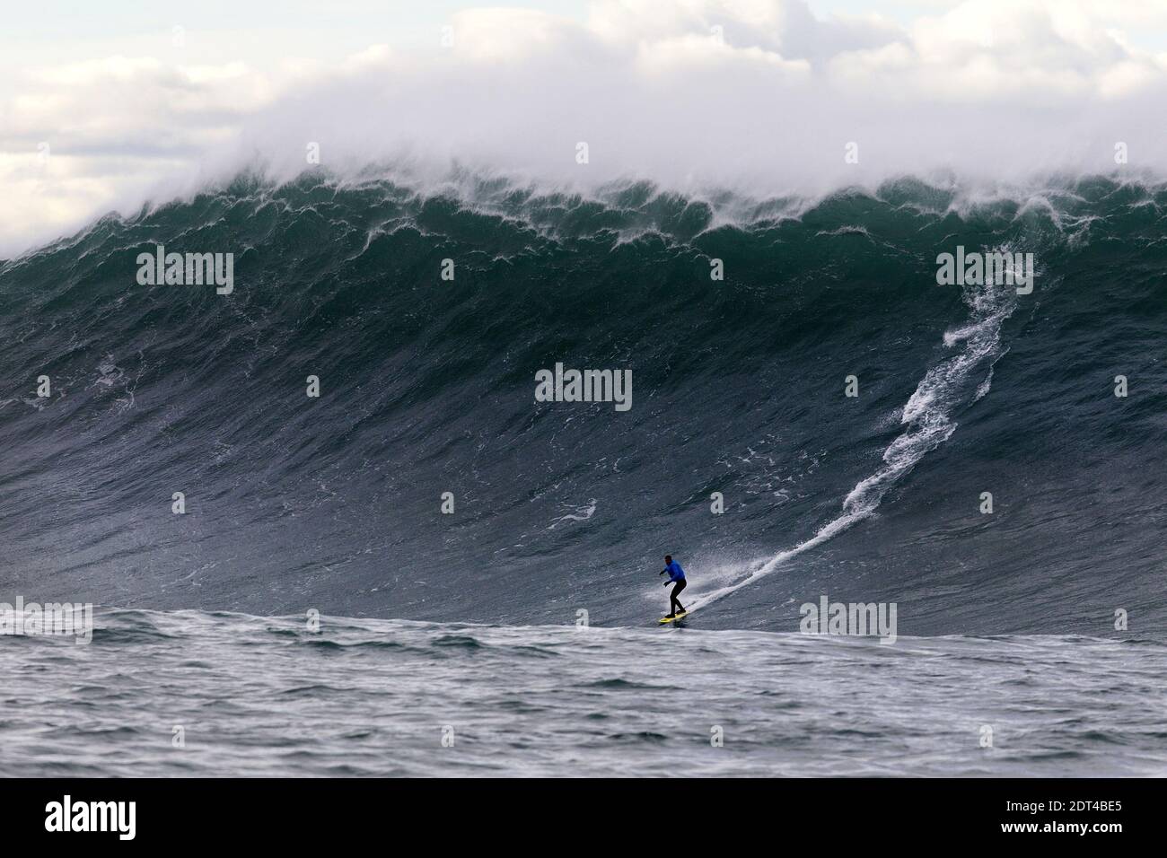 A man surfs the Belharra giant waves some two kilometers off the coast of the French basque country town of Urrugne near Saint-Jean-De-Luz, France on January 7, 2014. Thanks to certain climatic conditions in autumn and winter, a strong swell hits the Belharra Perdun underwater spur enabling a 10 to 15 metre wave to form. This wave is only surfed by experts who are towed out by a water scooter. Photo by Masurel/Photomobile/ABACAPRESS.COM Stock Photo