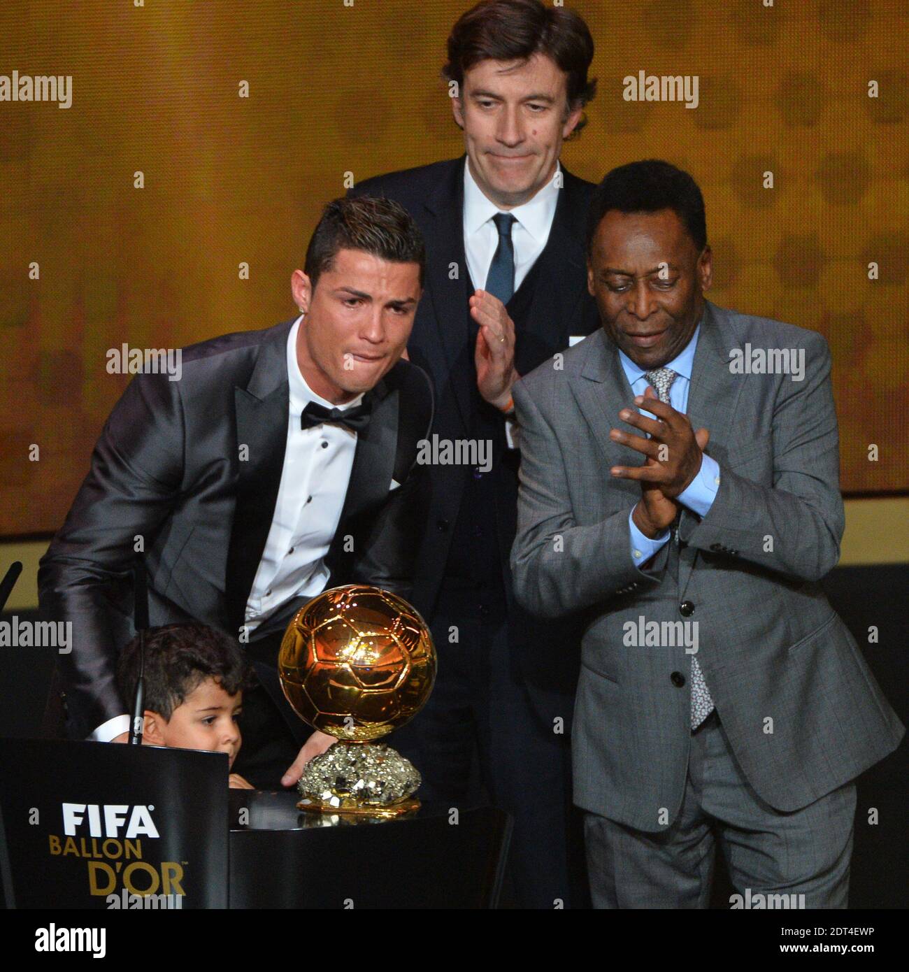 Portugal's Cristiano Ronaldo with son Cristiano Junior receiving the FIFA  Ballon d'Or award from Sepp Blatter, Francois Moriniere and Peleduring FIFA  Ballon d'Or 2013 trophy at the Kongresshalle in Zurich, Switzerland on