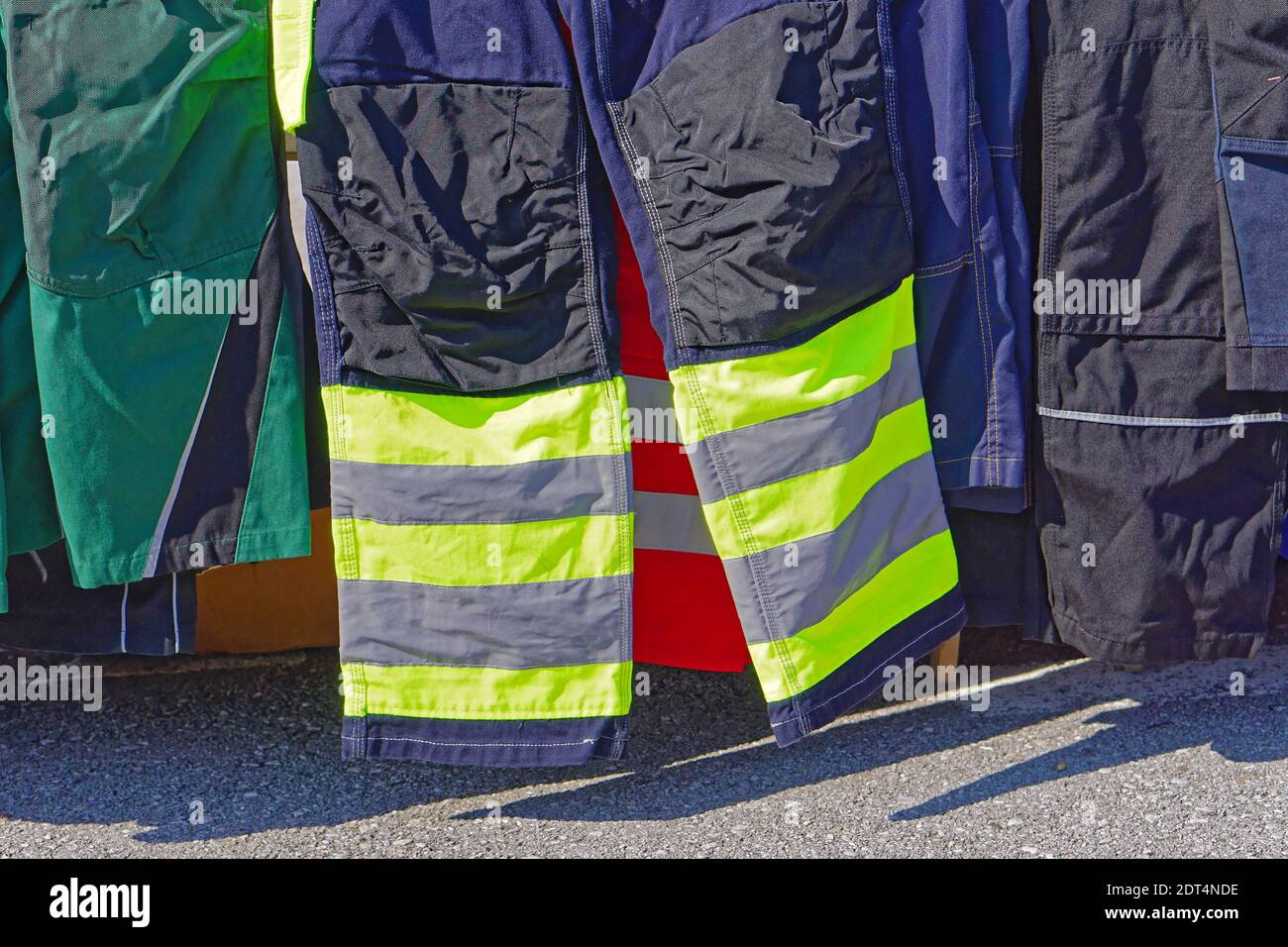 Safety pants with yellow reflective strips gear Stock Photo Alamy