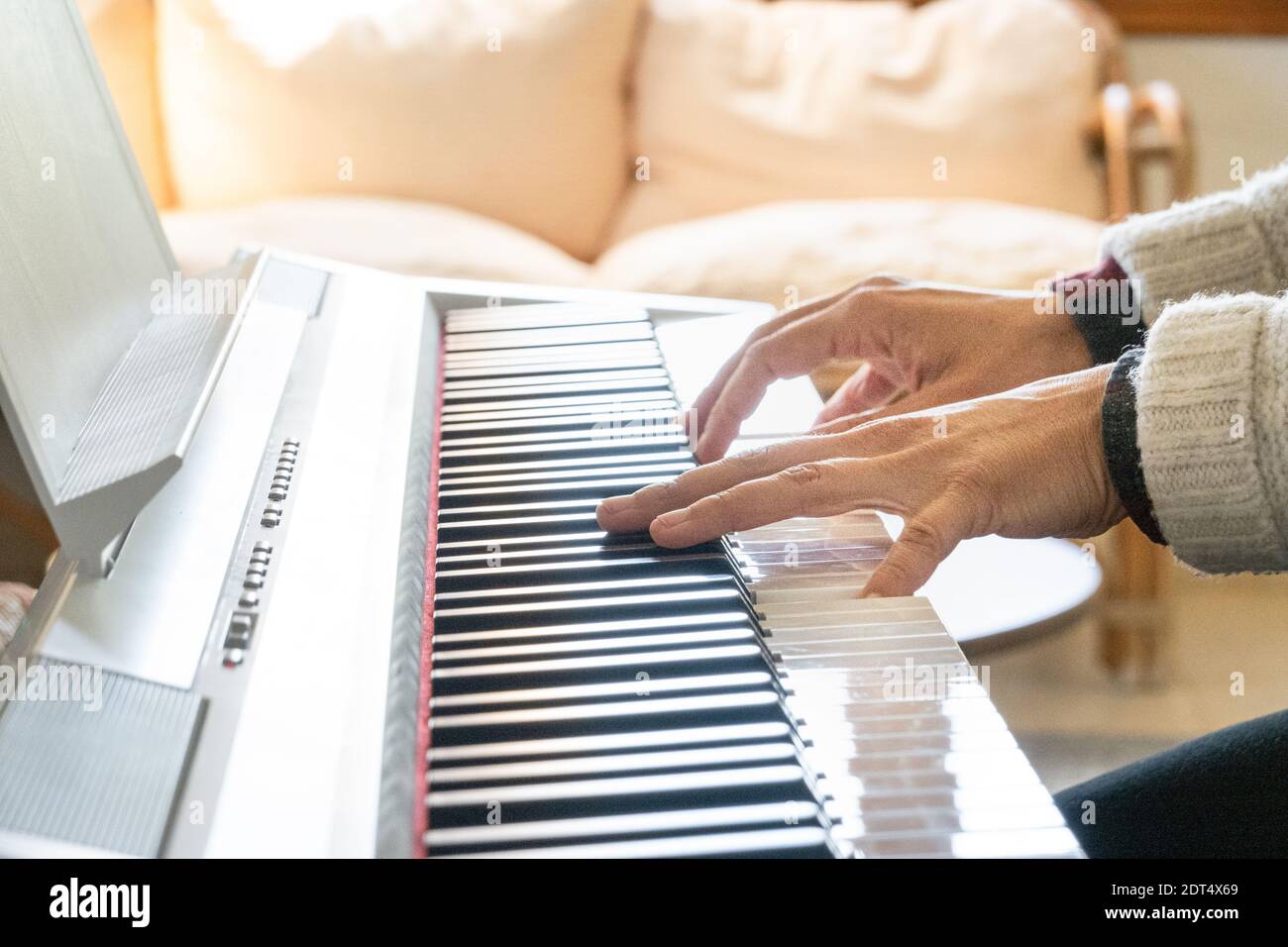 Playing paino hi-res stock photography and images - Alamy