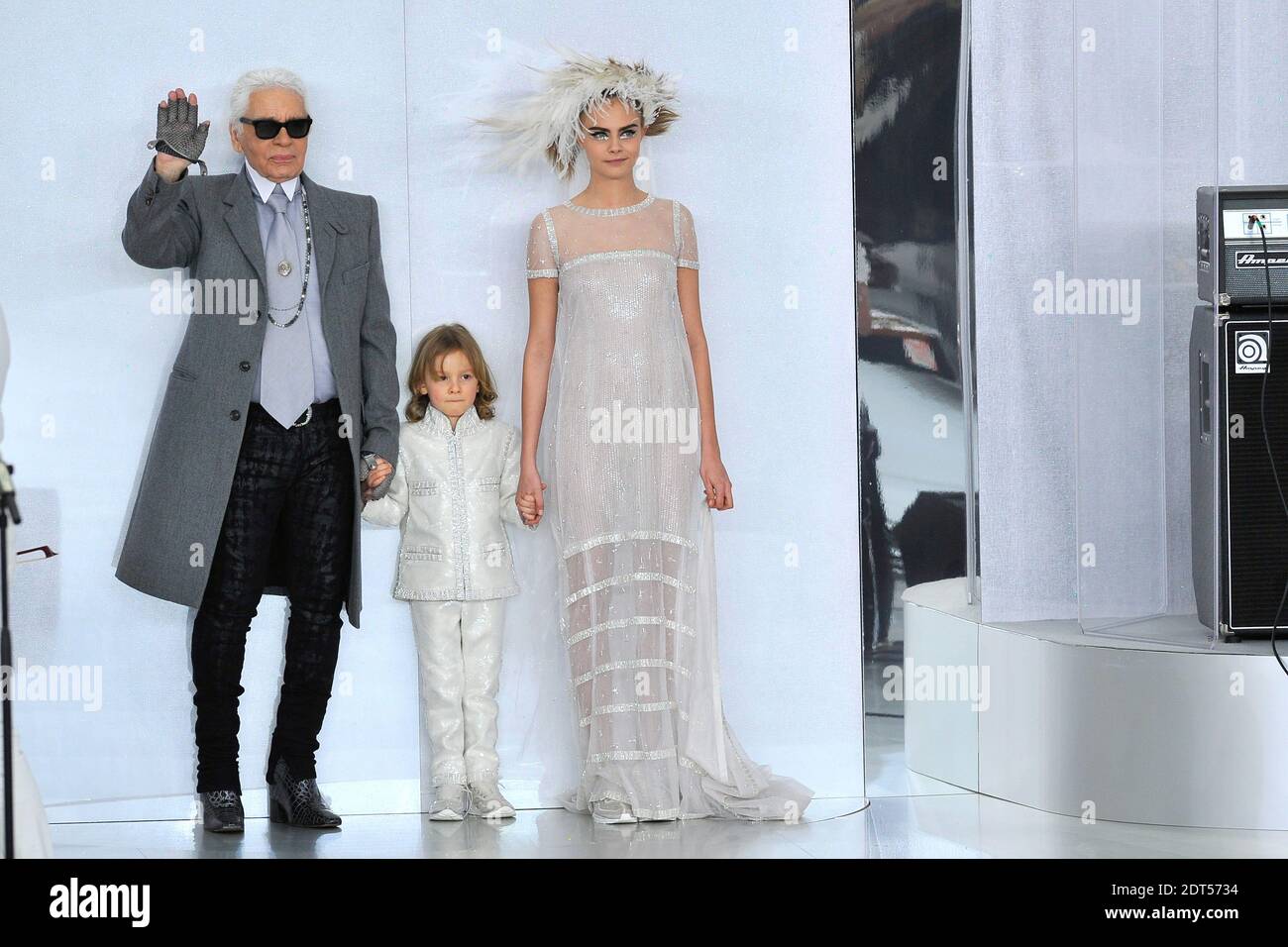 Paris, France. 4th Mar, 2014. German designer Karl Lagerfeld and british  model Cara Delevingne present the Chanel fall/winter 2014 /2015 collection  during the Paris Pret a porter fashion week in the set
