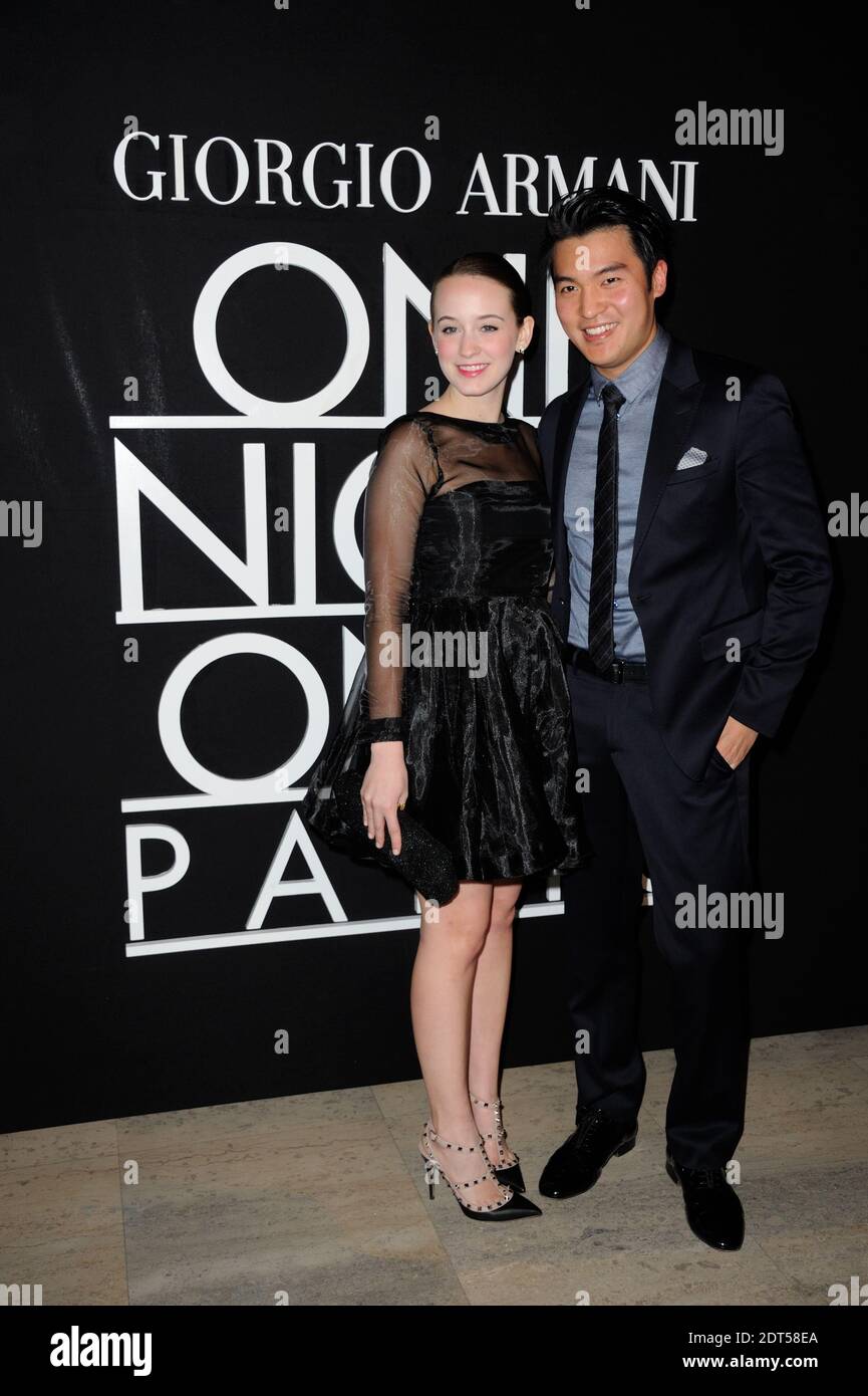 Catherine Peterson and Ray Chen attending the Giorgio Armani's Spring Summer 2014 Haute Couture