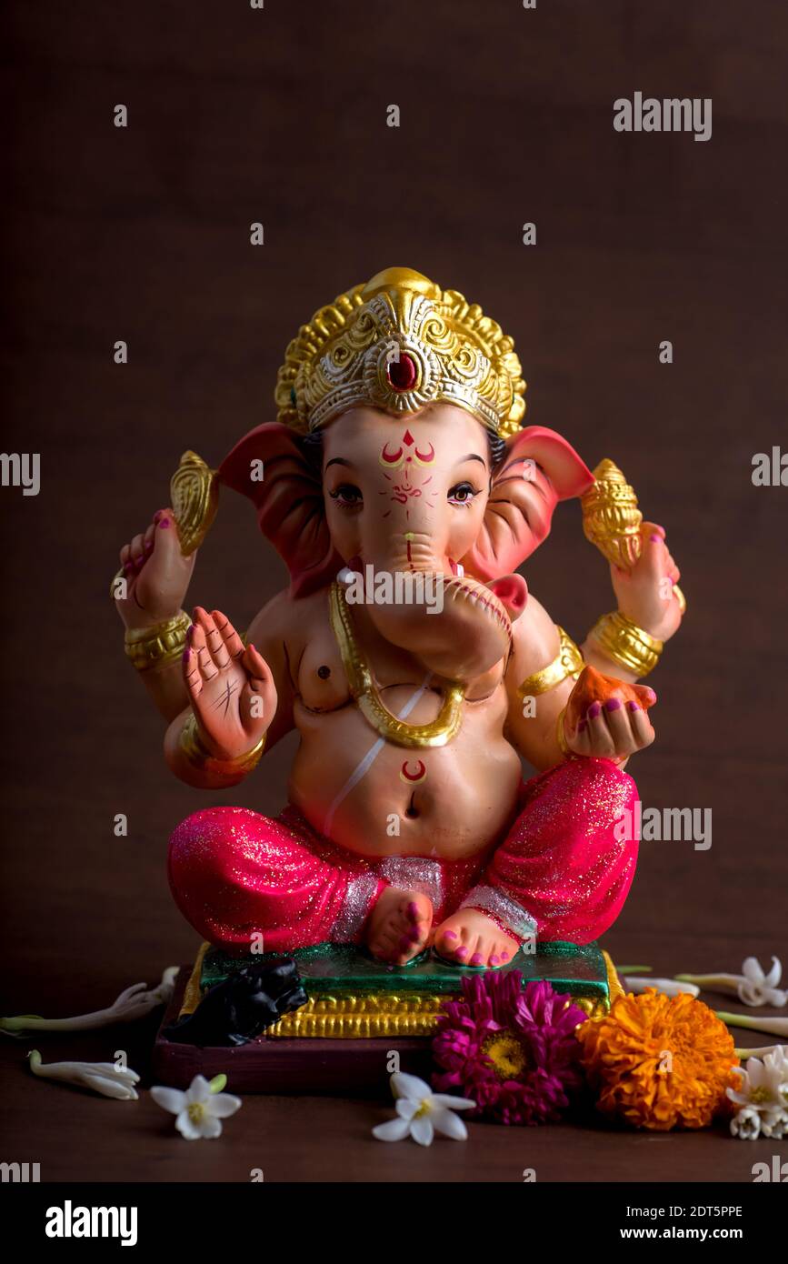 Close-up Of Ganesha Statue Against Colored Background Stock Photo ...