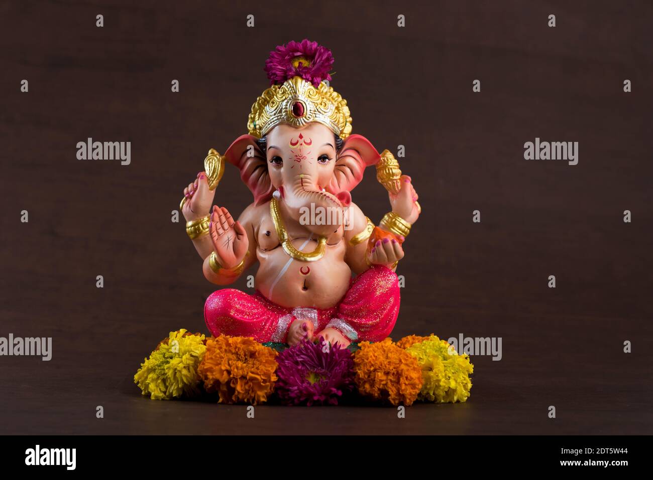 Close-up Of Ganesha Statue Against Colored Background Stock Photo ...