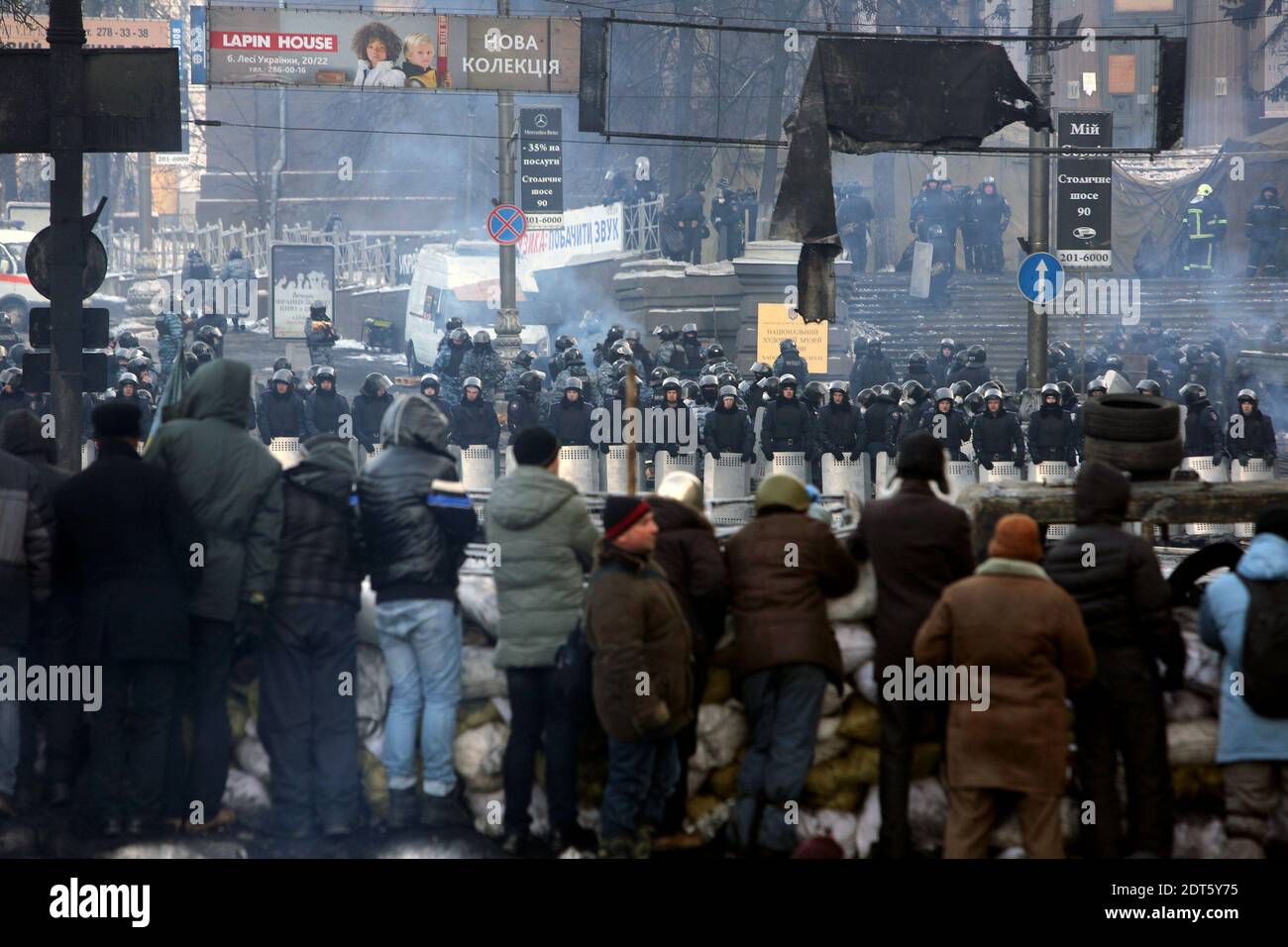Anti-government protestors stand on a barricade in front of the police on January 27, 2014 in Kiev, Ukraine. Photo by Rafael Yaghobzadeh/ABACAPRESS.COM Stock Photo