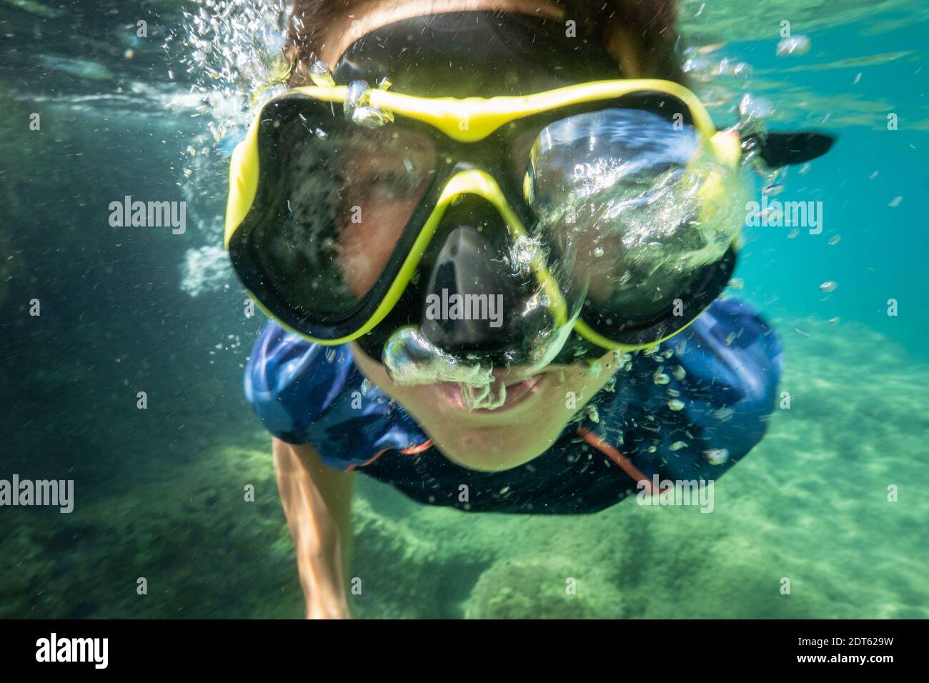 Boy wearing scuba mask swimming underwater Stock Photo Alamy