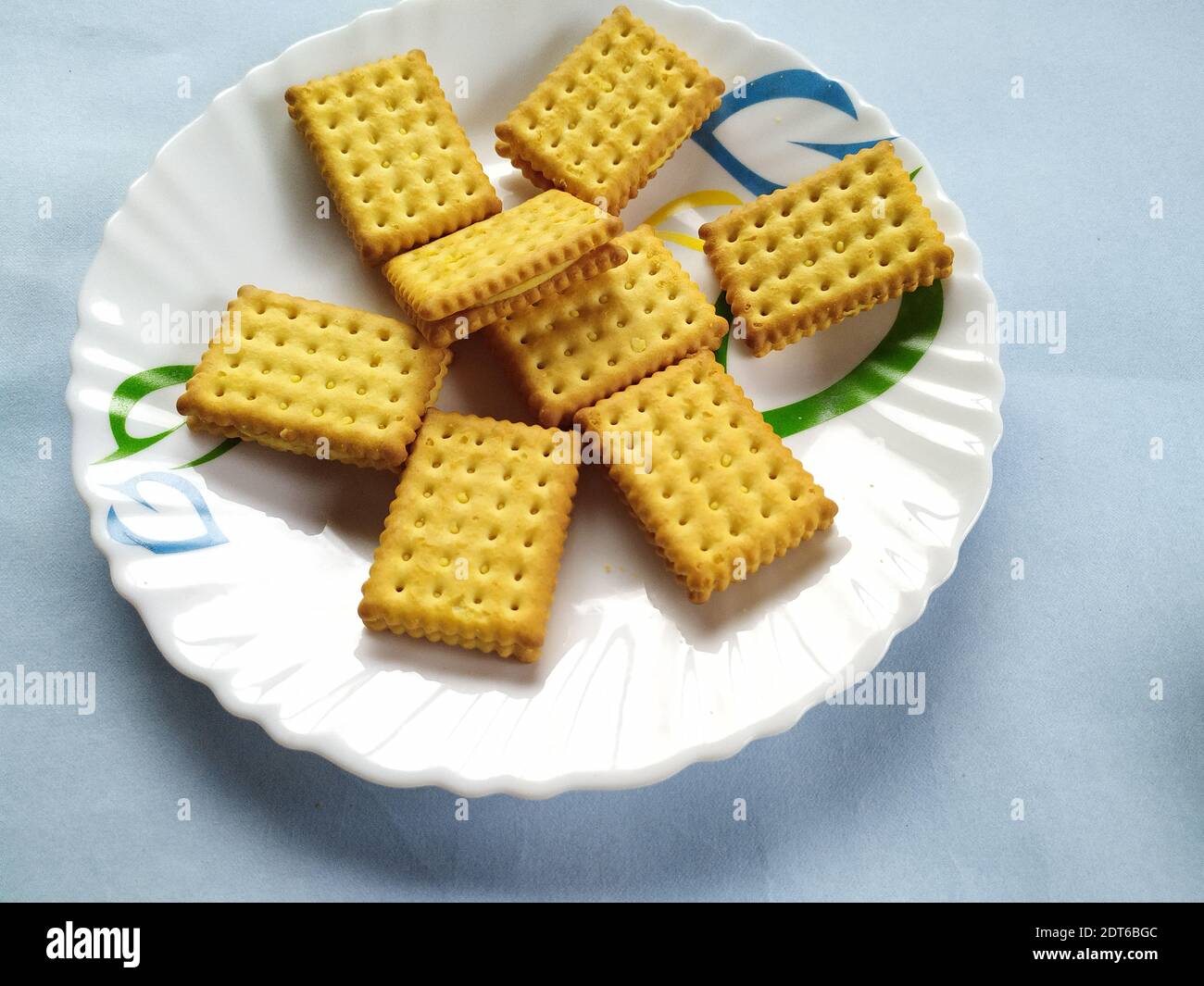 Cream Biscuits On Plate For Afternoon Tea, Colour Background Stock Photo -  Alamy