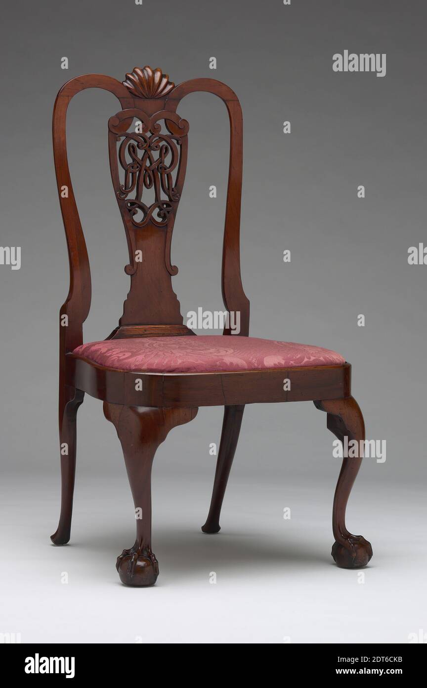 Side Chair, Mahogany, white oak, white pine, beech, eastern white pine, 41 13/16 × 18 1/8 × 19 1/2 in. (106.2 × 46 × 49.5 cm), This side chair is one of a set of six. The splats are pierced forming a cypher, an interlocking monogram of the initials RML, for the original owners, Robert and Margaret Livingston. Similar mirror-image monograms can be found engraved on silver made at this time. With its wide horseshoe-shaped seat and large claw-and-ball feet, this chair is a superb example of mid-eighteenth century New York furniture., Made in New York, New York, American, 18th century, Furniture Stock Photo